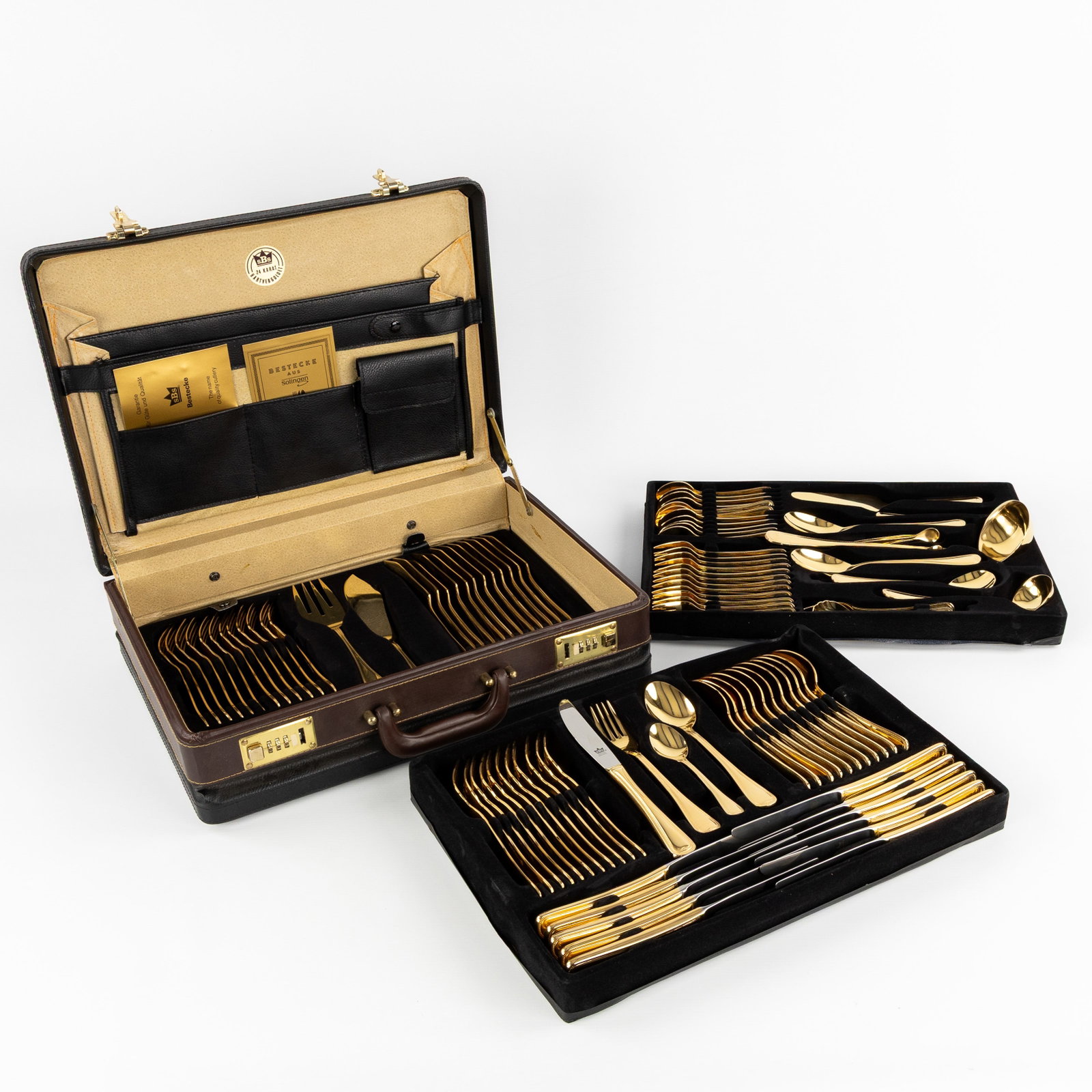 A 108-piece gold-plated 'Collection SBS Solingen' flatware cutlery set, Germany.: A 108-piece gold-plated 'Collection SBS Solingen' flatware cutlery set, Germany. Inox 18/10 gold-plated 23/24 karats. Model 'Louis XV' (45 x 11 x 35 cm)
