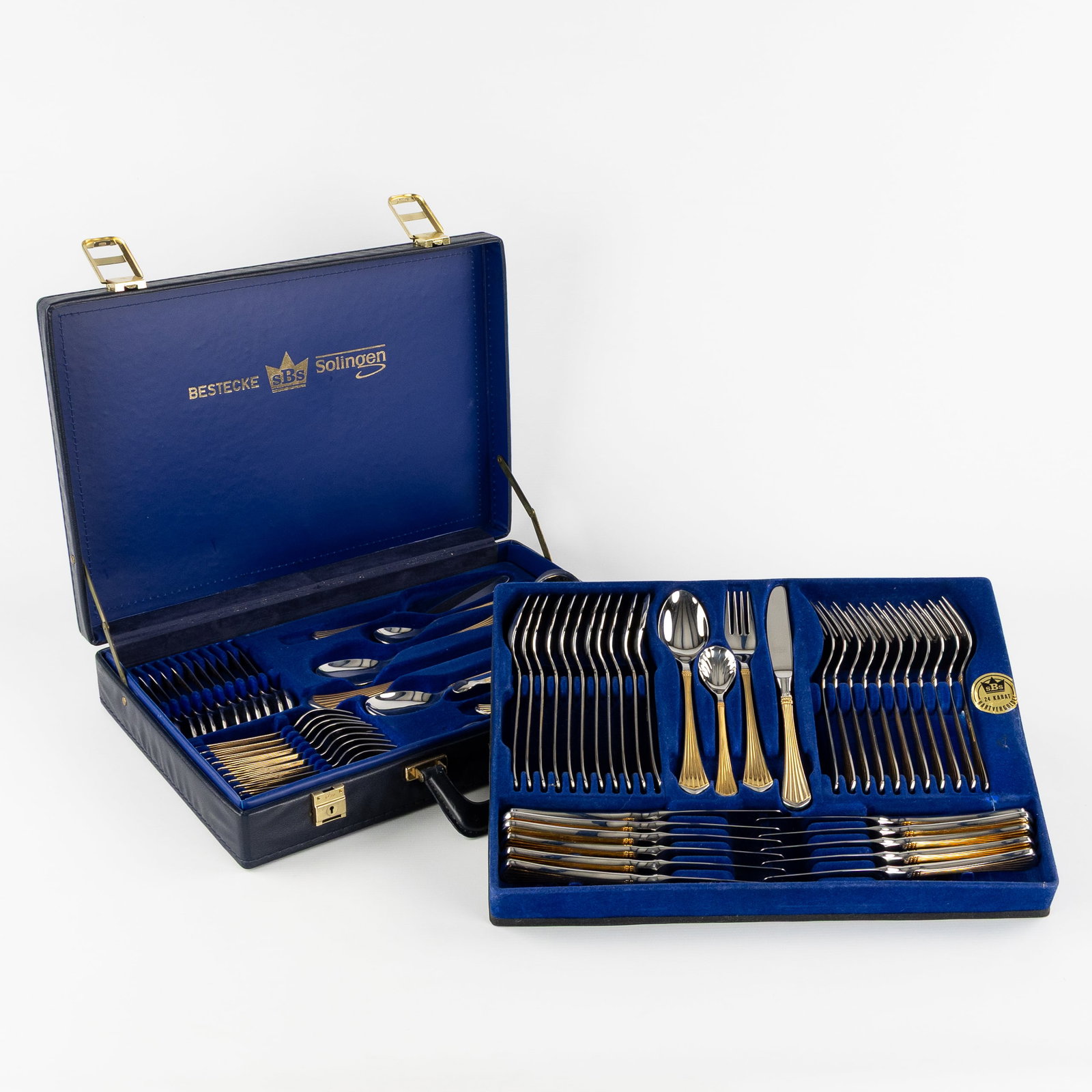Collection SBS Solingen, a 70-piece gold-plated cutlery set, in a case, Germany.: Collection SBS Solingen, a 70-piece gold-plated cutlery set, in a case, Germany. Stainless steel 18/10, edges plated with 23/24 carat gold. Assembled in a case, marked SBS Solingen. (45 x 9 x 32