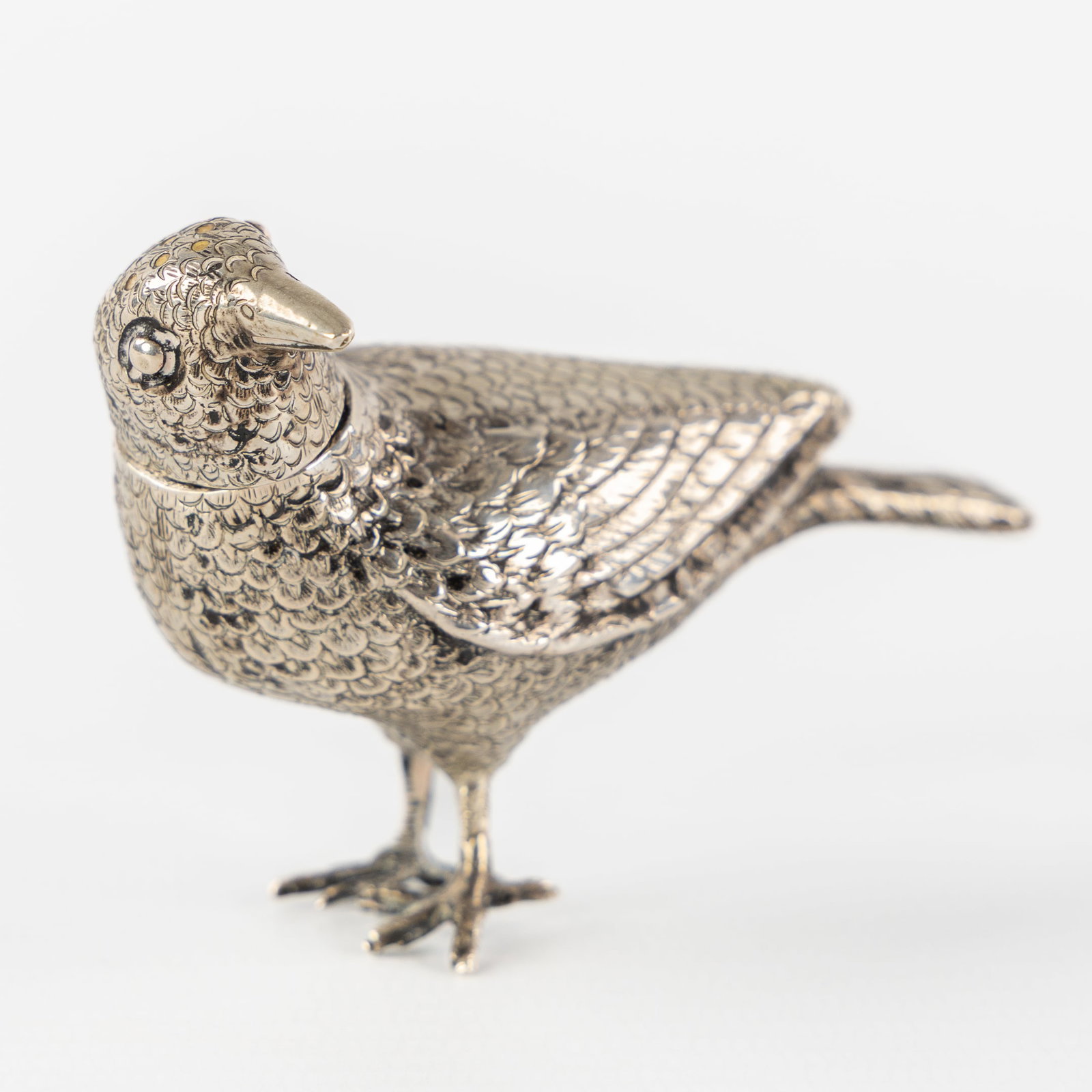 A Small Silver Crow, late 19th C. Silver, 49g.: A Small Silver Crow, late 19th century. Silver. A silver sculpture of a crow.Grade marked 800 for 800/1000.Maker's mark (?): SR under a crown.Later marked with probably the French import