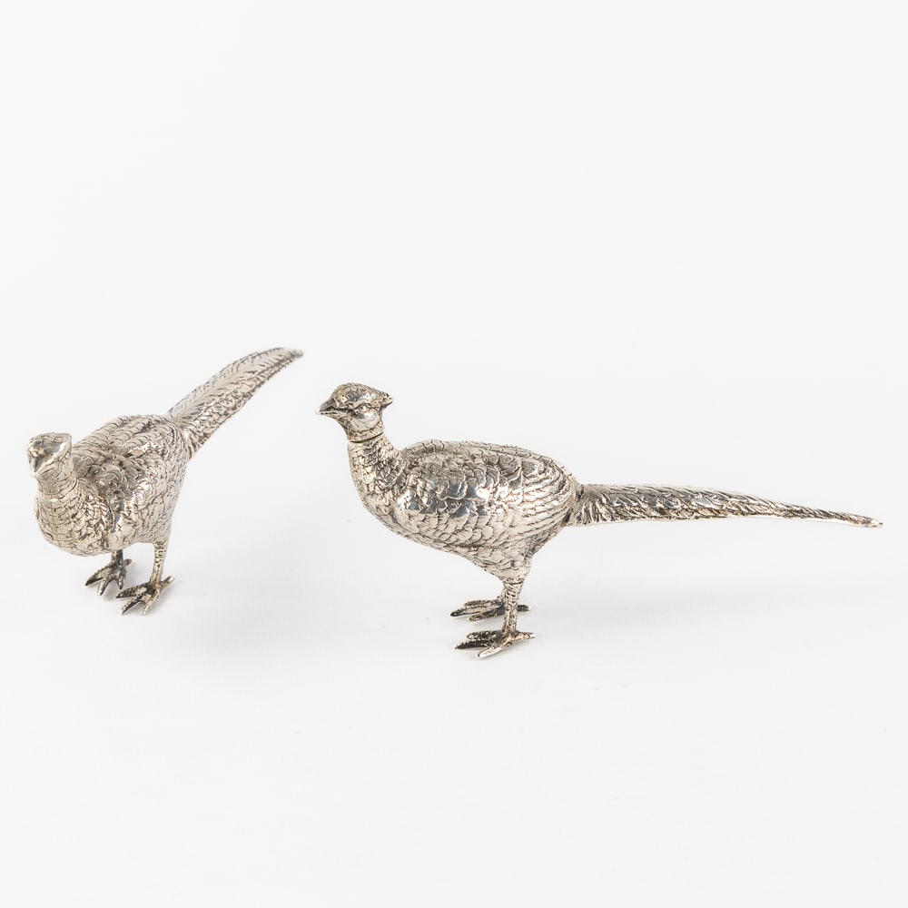 A Pair of Small Silver Pheasants, probably Italian, circa 1900. Silver, 155g.: A Pair of Small Silver Pheasants, probably Italian, circa 1900. Silver, 155g. A pair of silver sugar casters or shakers in the shape of pheasant