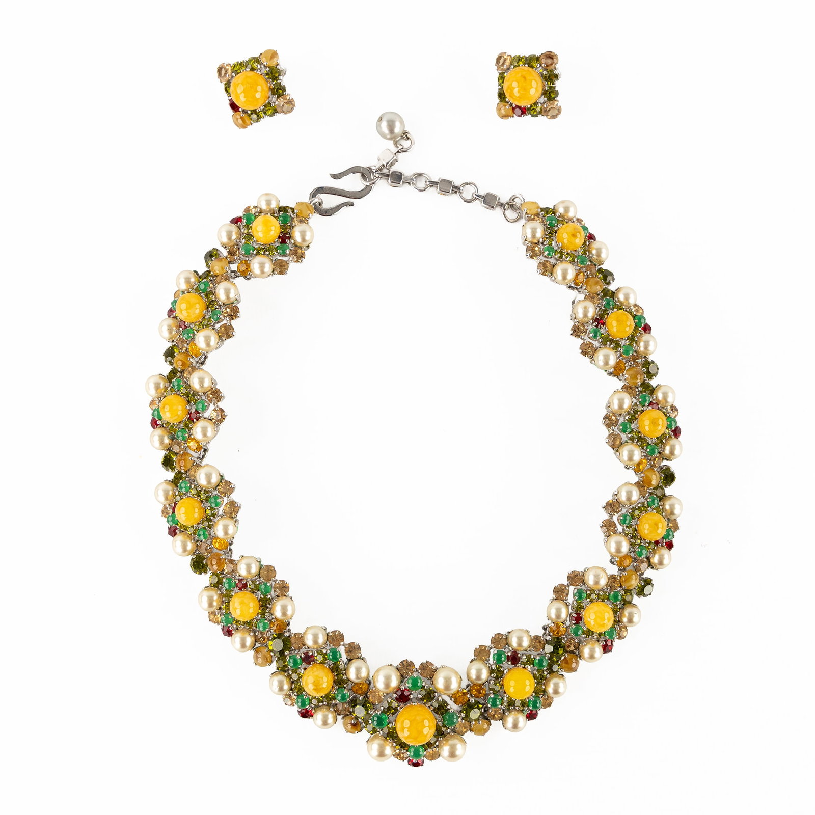 Christian Dior, a necklace and matching earrings, faux pearls, cabochons and cut crystal, 1959 and: Christian Dior, a necklace and matching earrings, faux pearls, cabochons and cut crystal, 1959 and 1962. Silver-coloured setting richly set with faux pearls, cabochons and cut crystal, Faux Bijoux.N