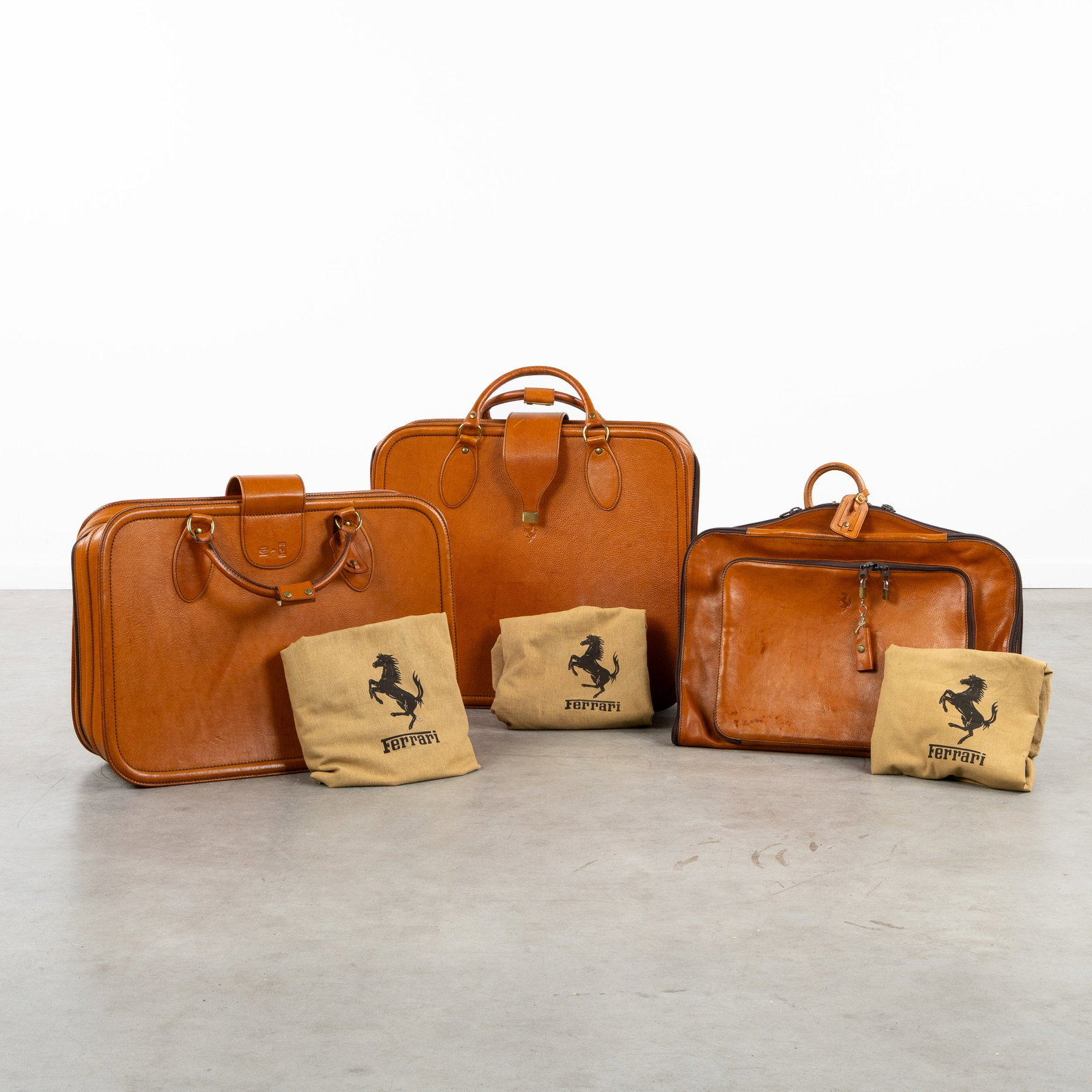 Schedoni Modena, Ferrari F348, a three-piece set of leather suitcases, for Ferrari, Italy, circa (1 of 14)