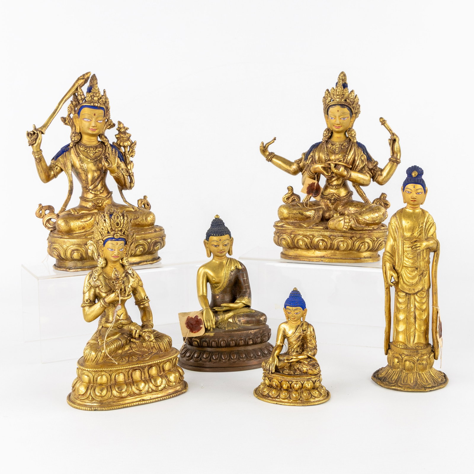 Six Budda or Guanyin figurines, gilt and patinated bronze. 20th C. (1 of 20)