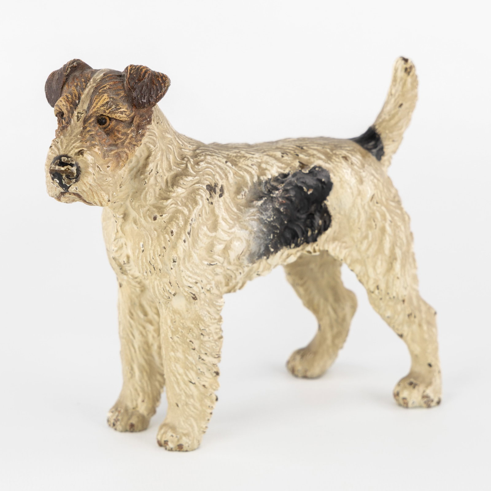 A Fox Terrier, Viennese bronze, in the style of Franz Bergmann, Austria, circa 1900.: A Fox Terrier, Viennese bronze, in the style of Franz Bergmann, Austria, circa 1900. Polychrome cold-patinated bronze.Depiction of a Fox Terrier dog.In the style of Franz Bergmann (1861-1936).
