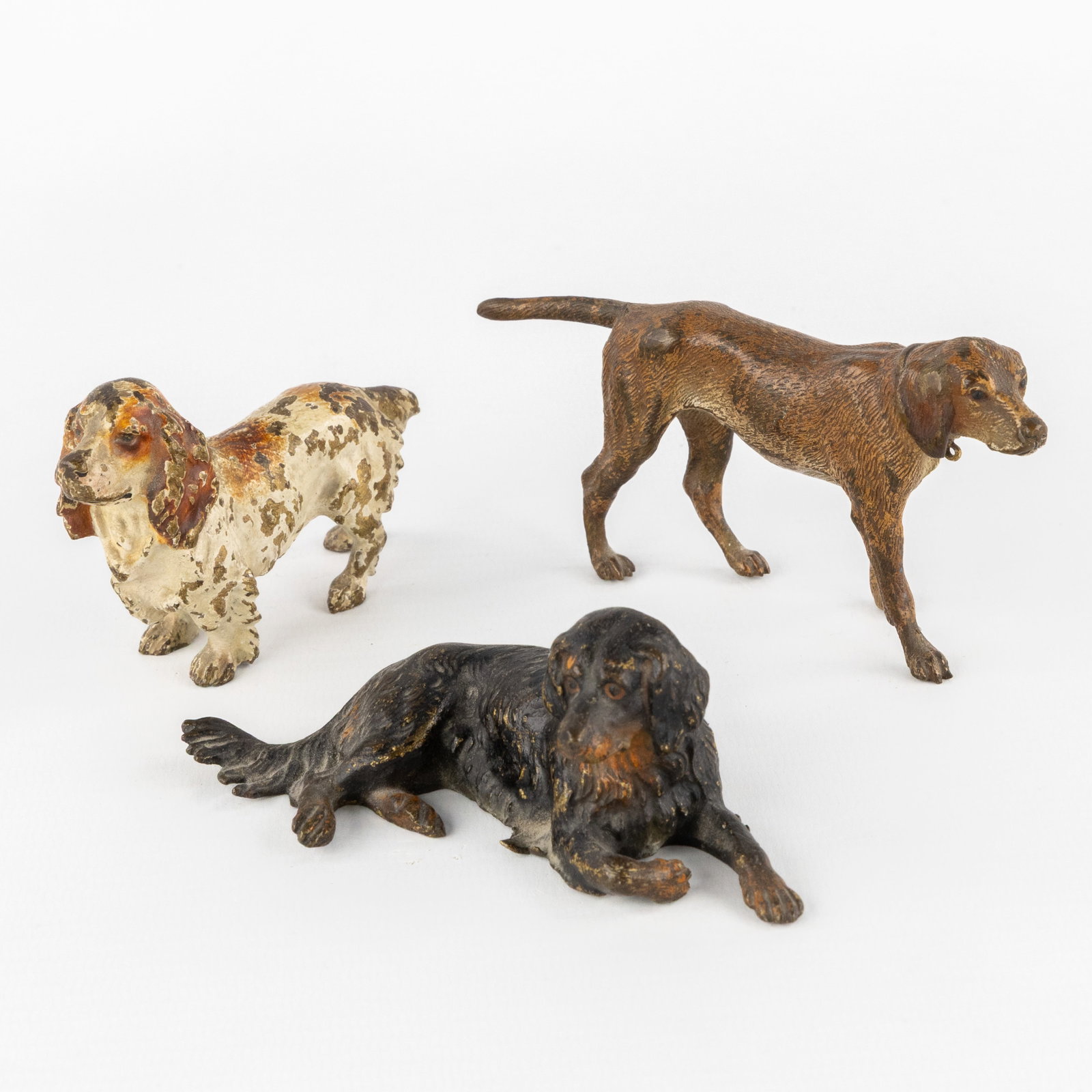 Three dogs, Viennese bronze, in the style of Franz Bergmann, Austria, circa 1900.: Three dogs, Viennese bronze, in the style of Franz Bergmann, Austria, circa 1900. Polychrome cold-patinated bronze.Depiction of a Cocker Spaniel, Retriever, and Setter.In the style of Franz Bergmann