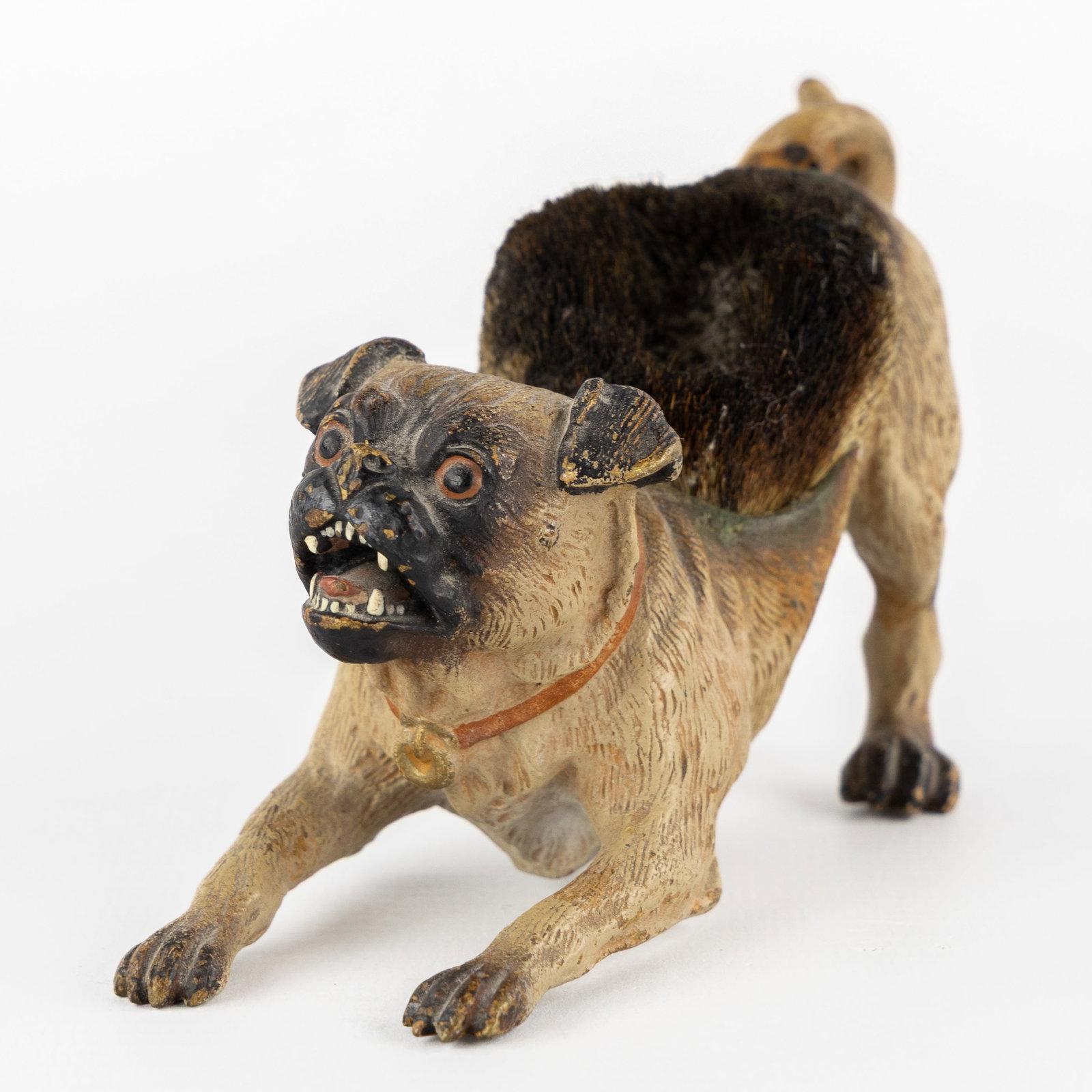 Franz Bergmann (1861-1936) A Pug with a pen smudge, Viennese bronze, Austria, circa 1900.: Franz Bergmann (1861-1936) A Pug with a pen smudge, Viennese bronze, Austria, circa 1900. Polychrome cold-patinated bronze.Depiction of a Pug with a pen smudge of animal hair on its back, used to remo
