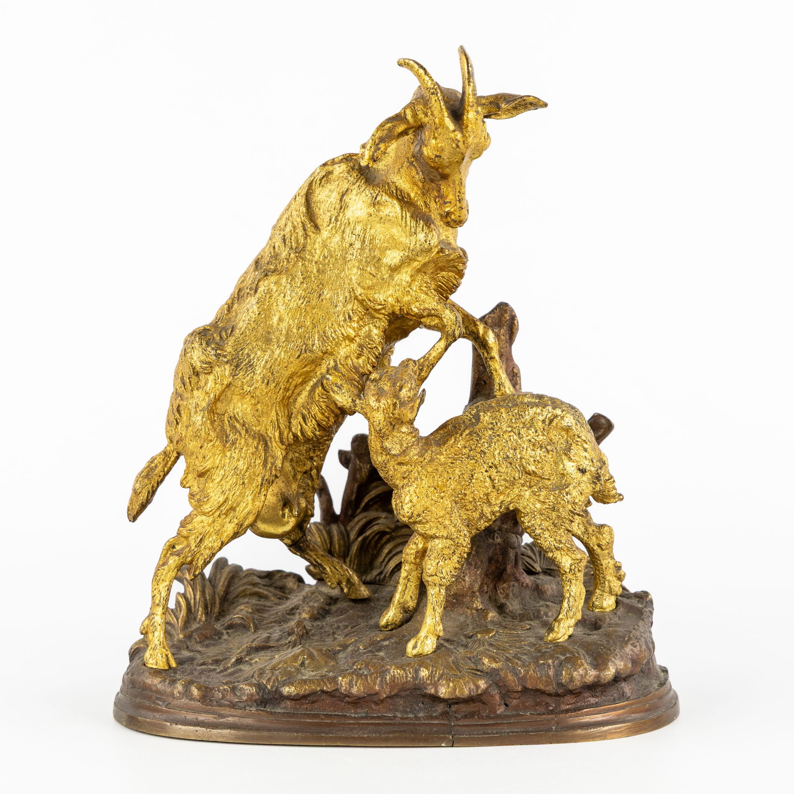 After Pierre-Jules Mene (1810-1879) 'Chévre et Chevreau', patinated and gilded bronze.: After Pierre-Jules Mene (1810-1879) 'Chévre et Chevreau', patinated and gilded bronze. Gilded and patinated bronze.Depiction of a mother goat with a kid.After Pierre-Jules Mene, unsigned.