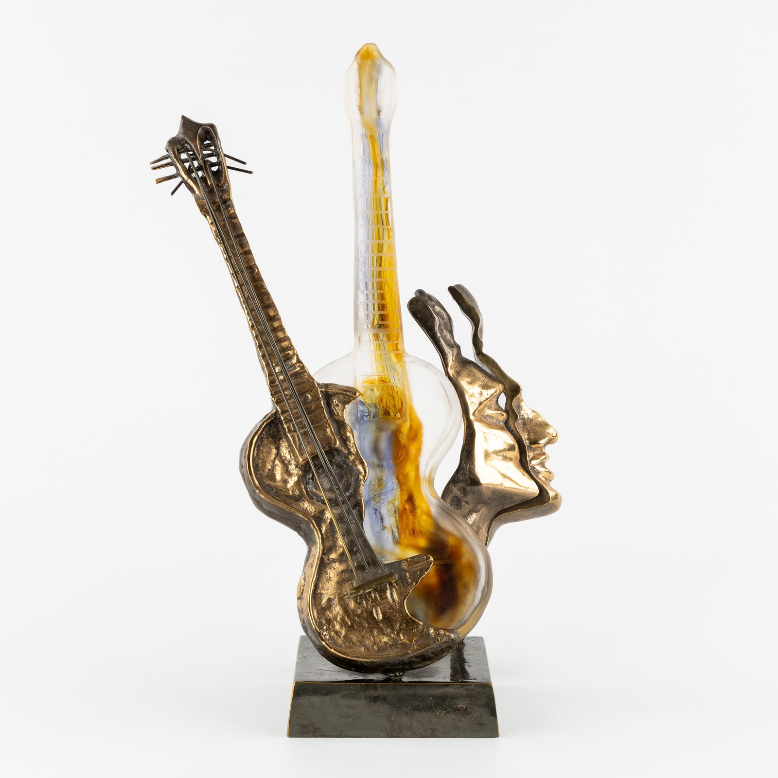 Yves Lohé (1947) 'La Guitare', a table lamp, polished bronze and pâte de verre.: Yves Lohé (1947) 'La Guitare', a table lamp, polished bronze and pâte de verre. Polished bronze and pâte de verre.Signed 'Lohe' on the base and in the pâte de verre.Table lamp wi