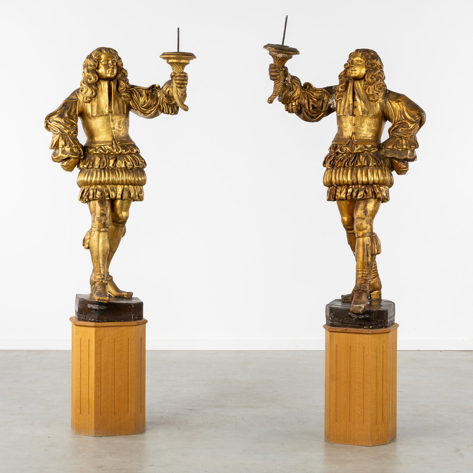 A Pair of large torchbearers or candlesticks, sculptured and gilded wood, Baroque style, France,: A Pair of large torchbearers or candlesticks, sculptured and gilded wood, Baroque style, France, 19th century. Sculptured and gilded wood.Torchbearers or life-size candlesticks in the shape of Louis X