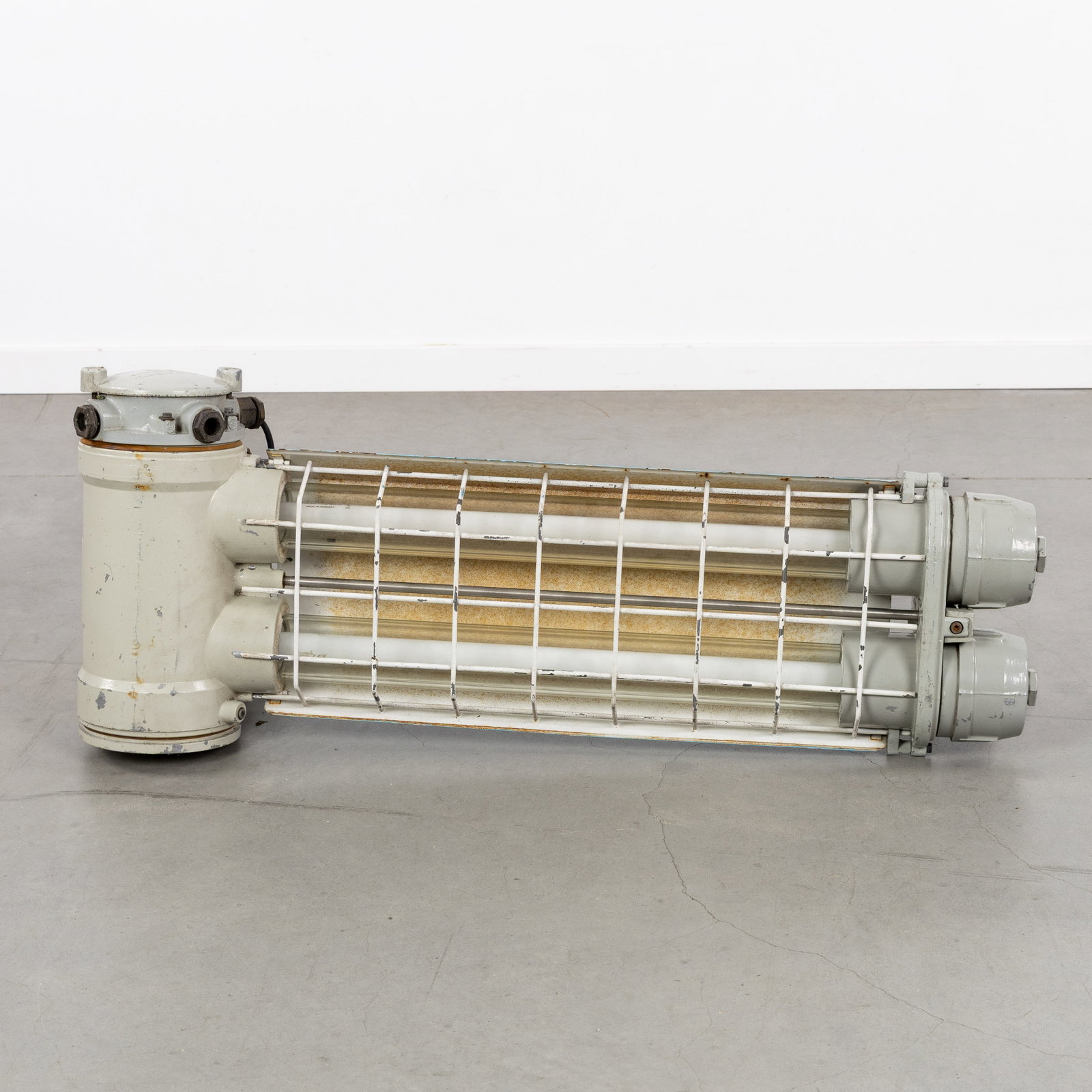 A Heavy German explosion-proof industrial lamp or bunker lamp, VEB Narva or VEB EOW, GDR, circa: A Heavy German explosion-proof industrial lamp or bunker lamp, VEB Narva or VEB EOW, GDR, circa 1970. Patinated metal.Robust, explosion-proof ("Ex-geschützte") luminaire for heavy industry, minin