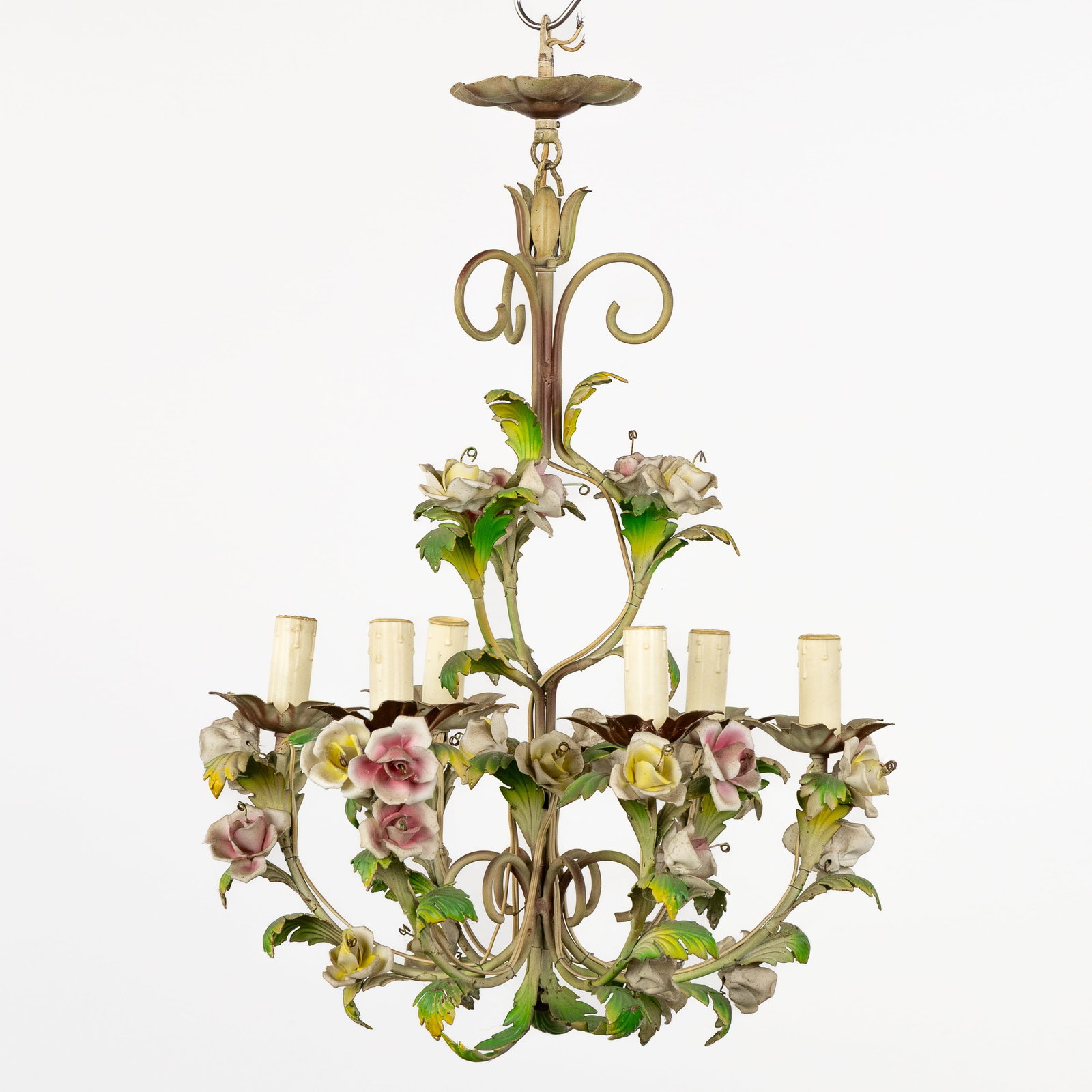 A Decorative chandelier with porcelain flowers, patinated metal.: A Decorative chandelier with porcelain flowers, patinated metal. Patinated metal and porcelain.Chandelier with 6 light points.Decorated with porcelain flowers/roses and patinated metal leaves.
