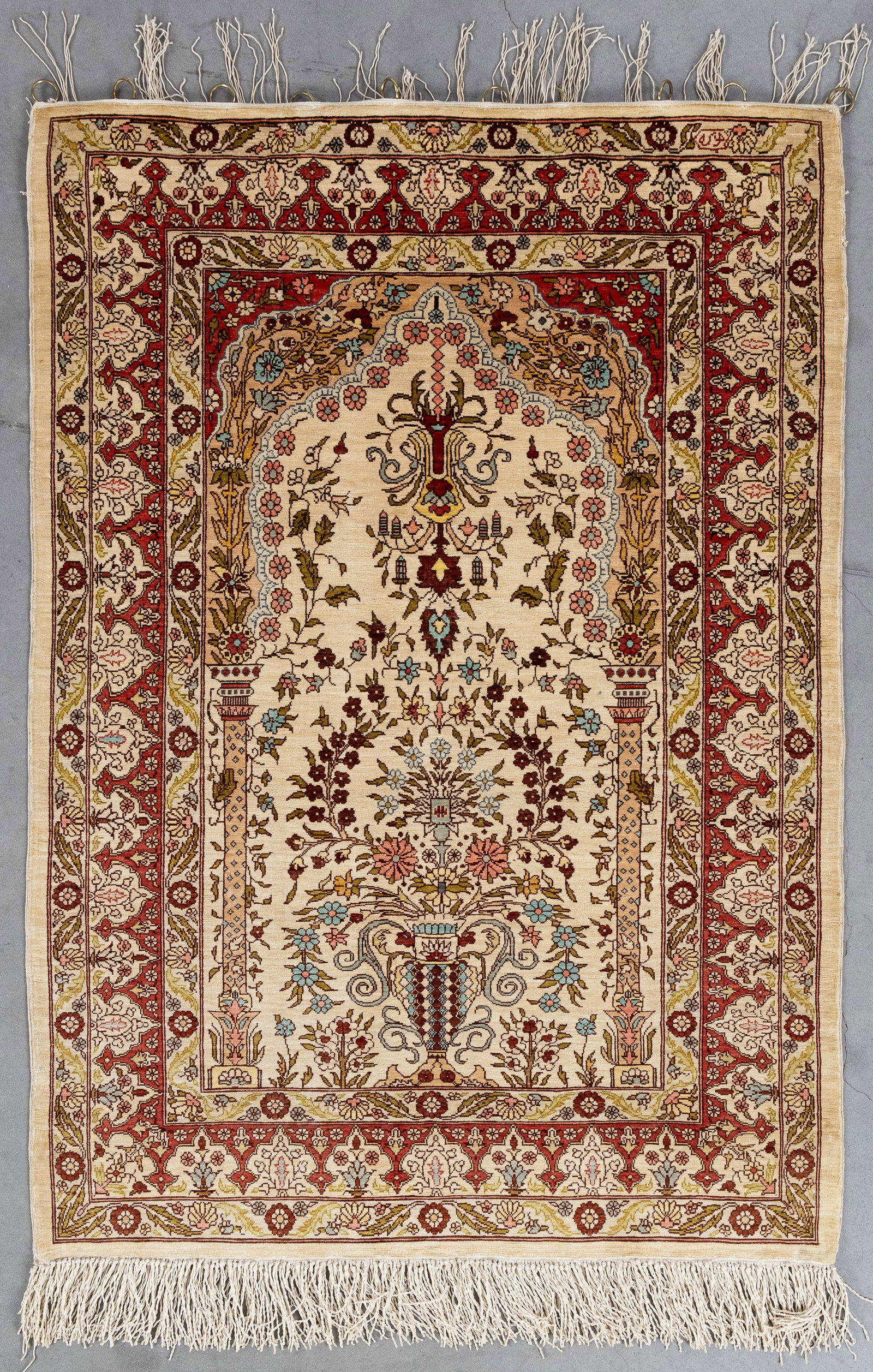 An Oriental hand-made carpet, silk, Hereke, Turkiye (96 x 67.5 cm). (1 of 6)