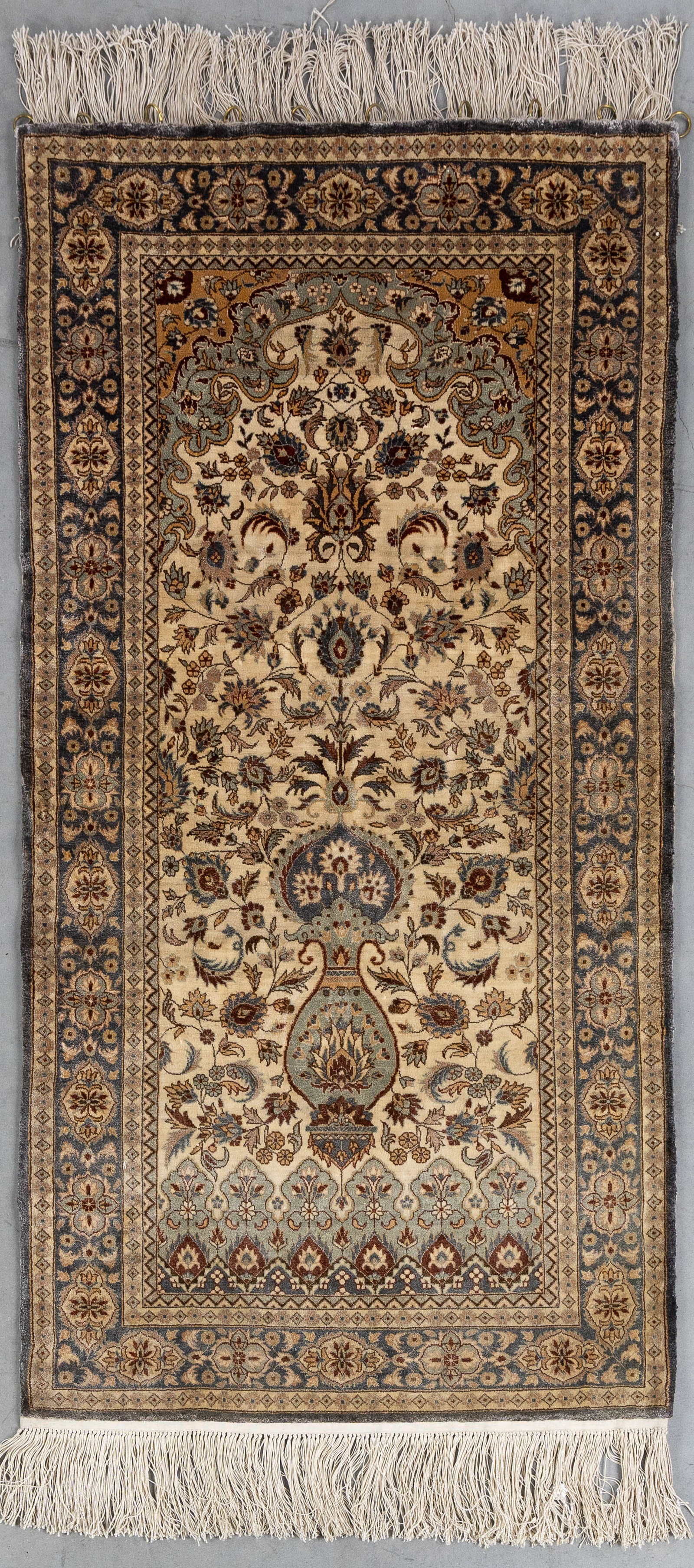 An Oriental hand-made carpet, probably wool and silk, Kashan or Isfahan, Iran (124 x 63.5 cm). (1 of 6)