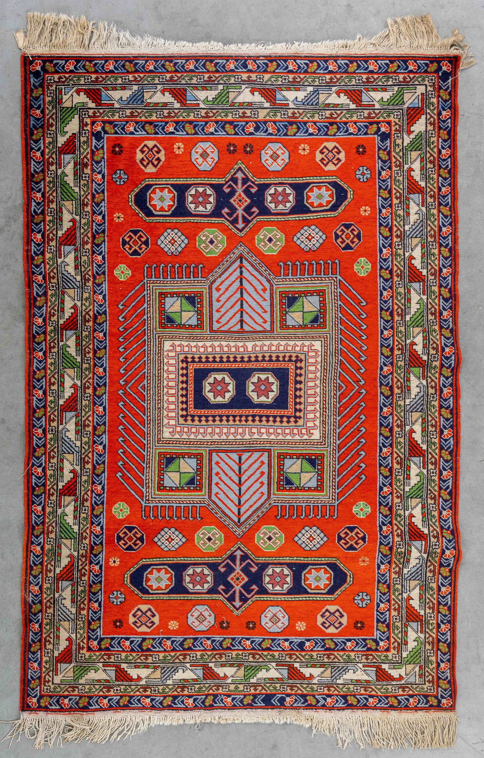 An Antique Oriental hand-made carpet, probably Caucasus (165 x 118 cm).: An Antique Oriental hand-made carpet, probably Caucasus (165 x 118 cm). (118 x 165 x 0 cm)