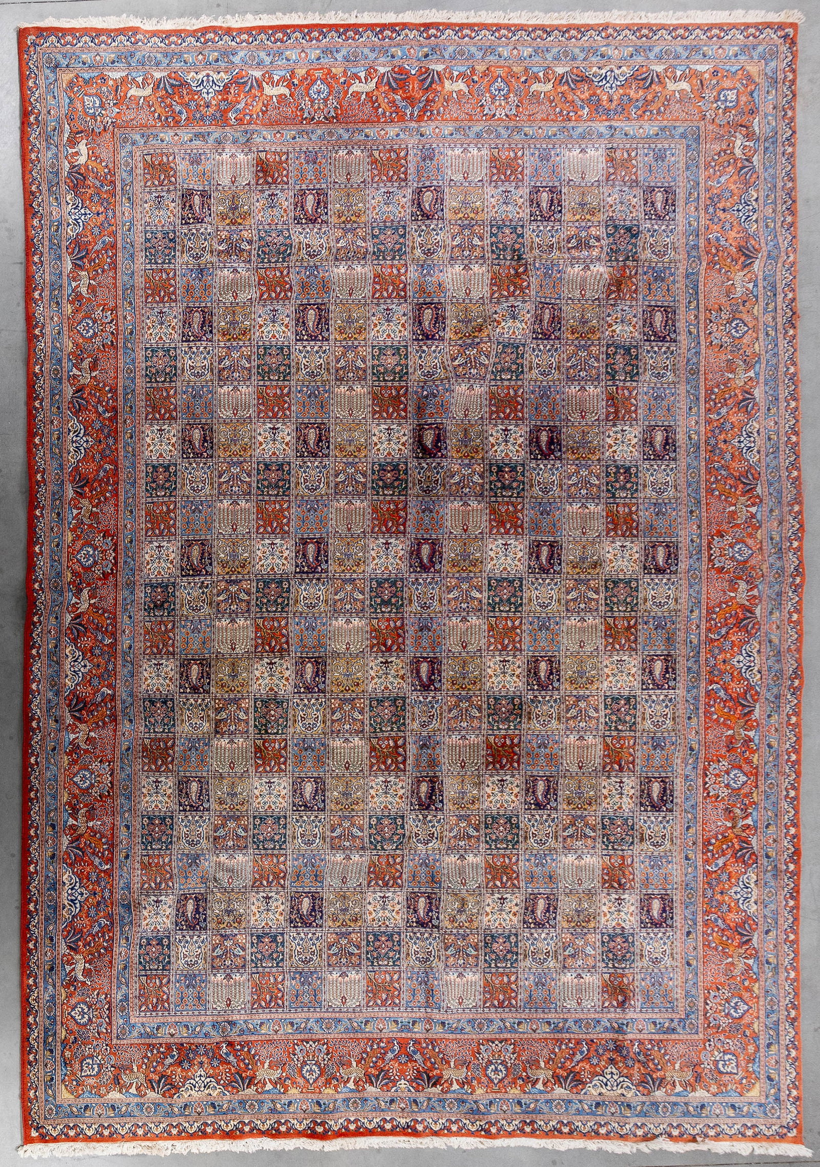A Large Oriental hand-made carpet, wool and silk, Moud, Iran (339 x 489 cm). (1 of 8)