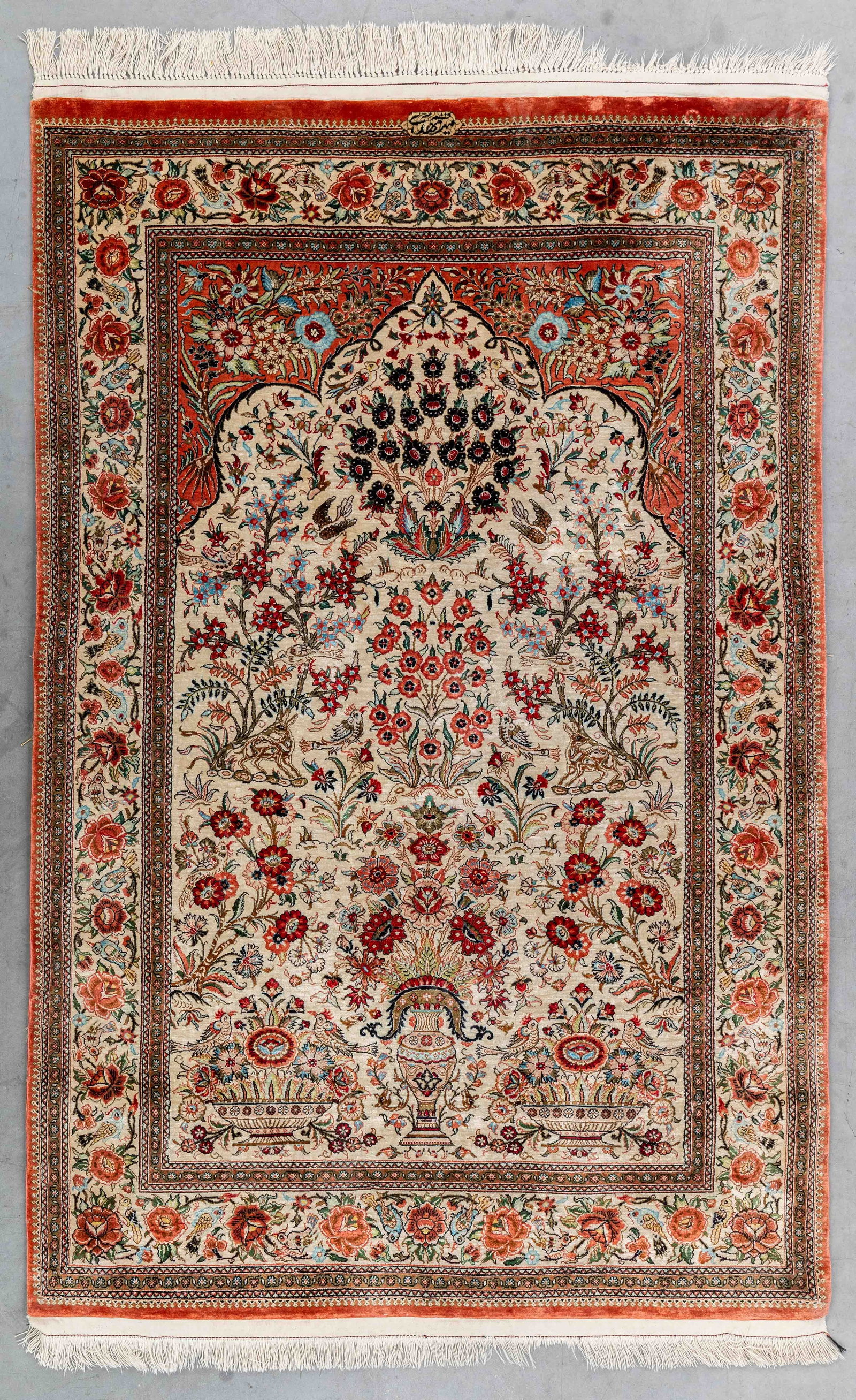 An Oriental hand-made carpet, silk, signed Mir Mehdi, Ghoum, Iran (158 x 102 cm). (1 of 6)