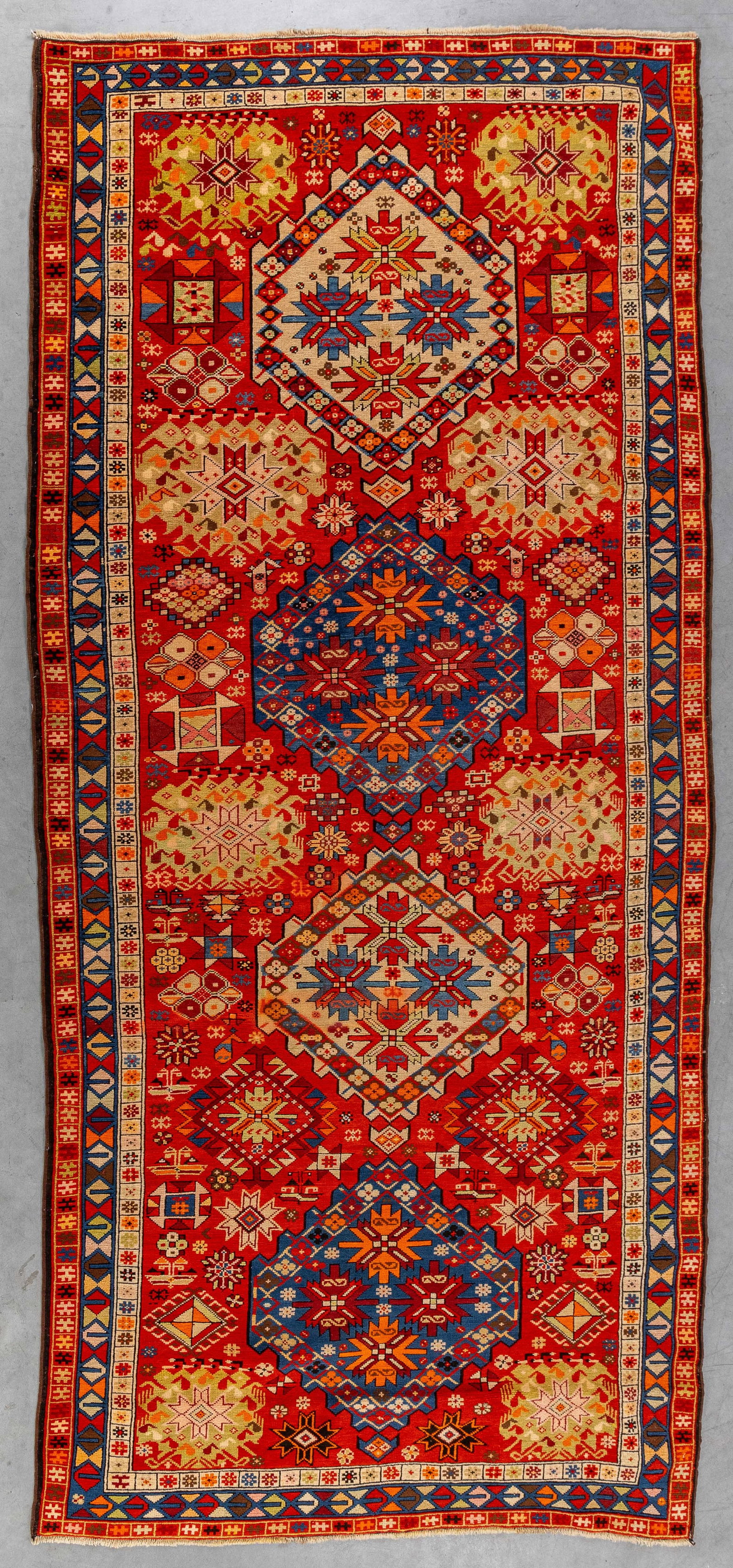 An Antique Oriental hand-made carpet, Caucasus, Russia (310 x 142.5 cm). (1 of 7)