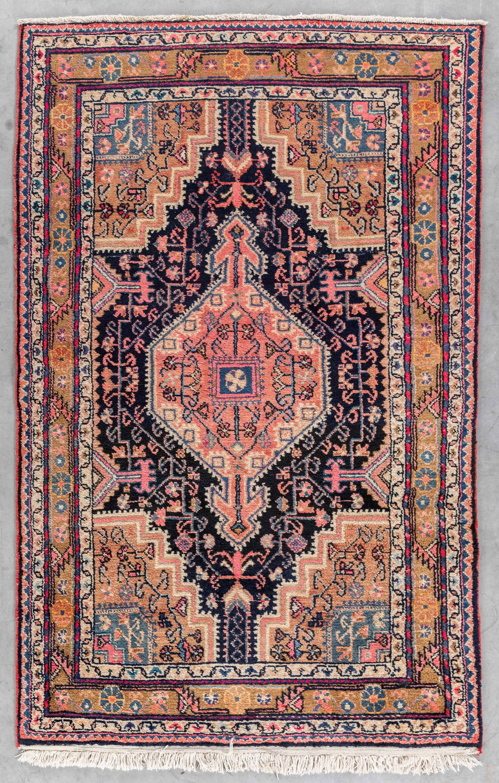 An Oriental hand-made carpet, Hamadan, Iran (181 x 112.5 cm).: An Oriental hand-made carpet, Hamadan, Iran (181 x 112.5 cm). (112.5 x 181 x 0 cm)