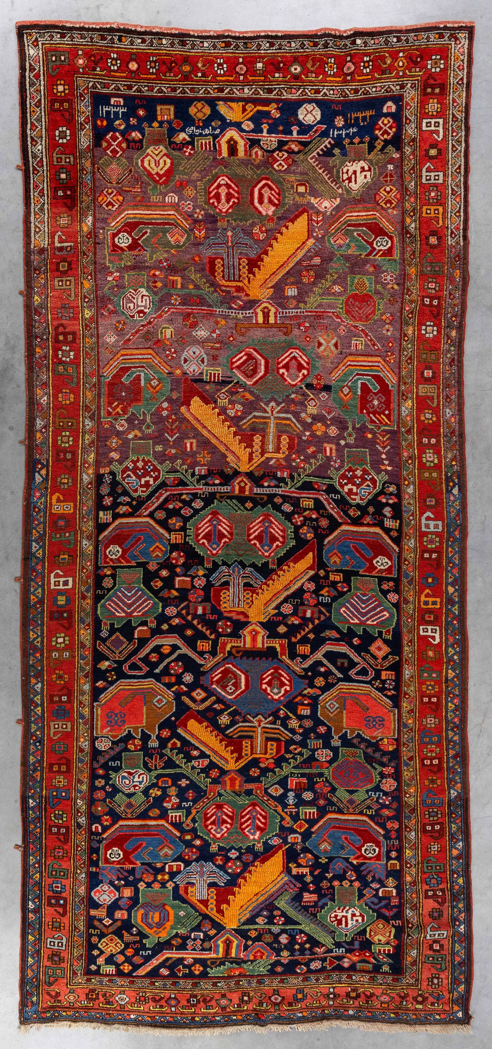 An Antique Oriental hand-made carpet, Azerbaijan, Russia (362 x 168 cm).: An Antique Oriental hand-made carpet, Azerbaijan, Russia (362 x 168 cm). (168 x 362 x 0 cm)