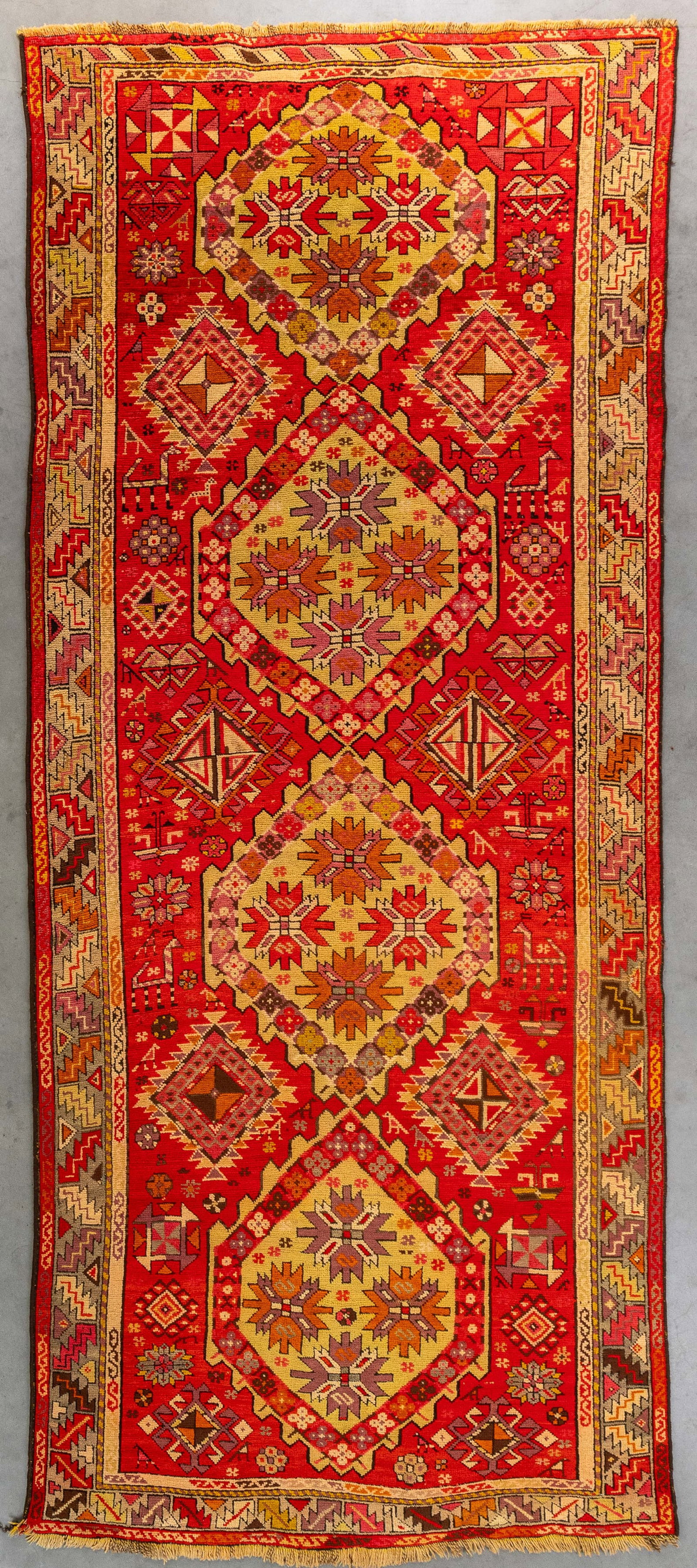 An Oriental hand-made carpet, Russia (130 x 309 cm).: An Oriental hand-made carpet, Russia (130 x 309 cm). (130 x 0 x 309 cm)