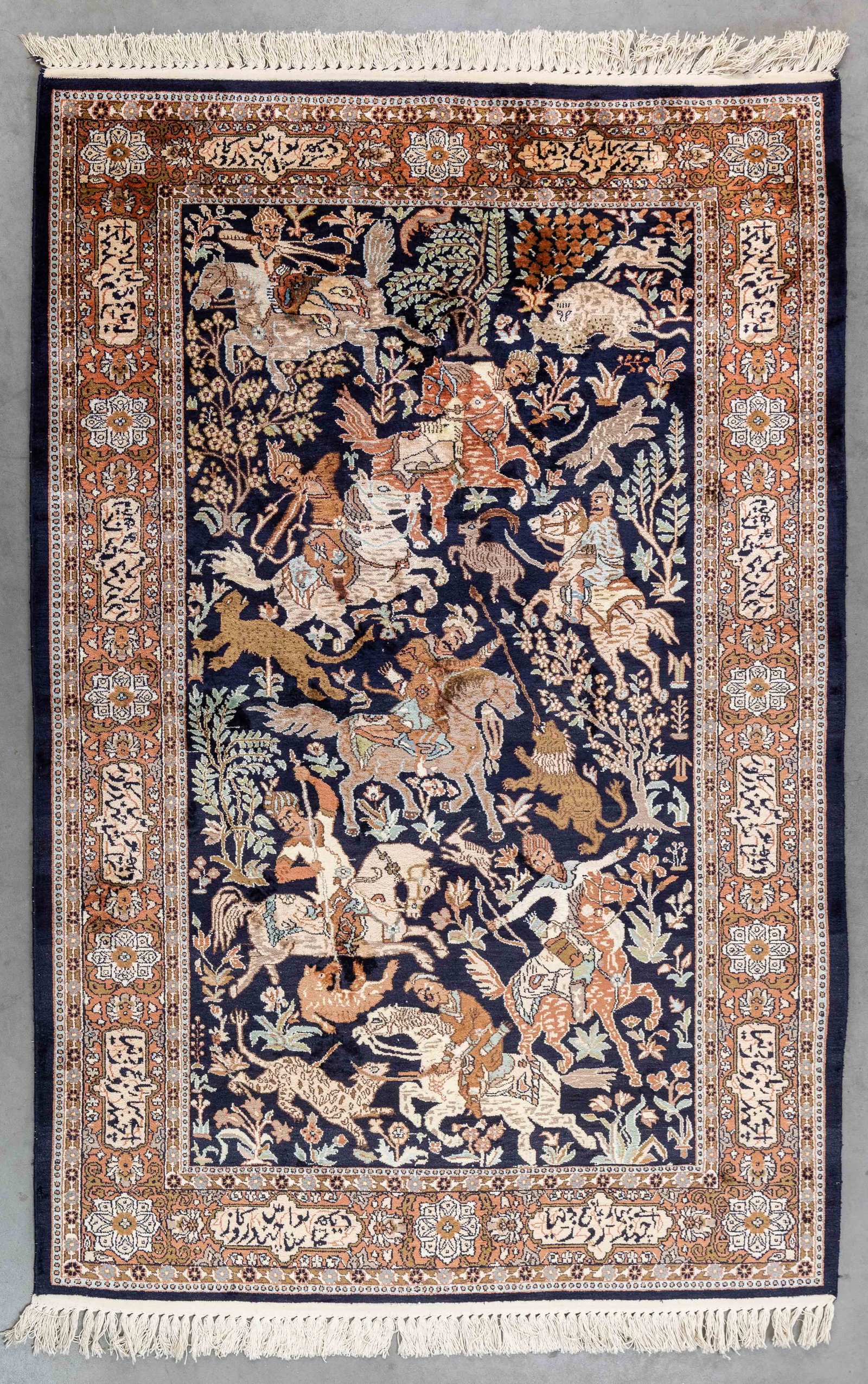 An Oriental hand-made figurative carpet, Kashmir, signed (124 x 185 cm).: An Oriental hand-made figurative carpet, Kashmir, signed (124 x 185 cm). (124 x 0 x 185 cm)
