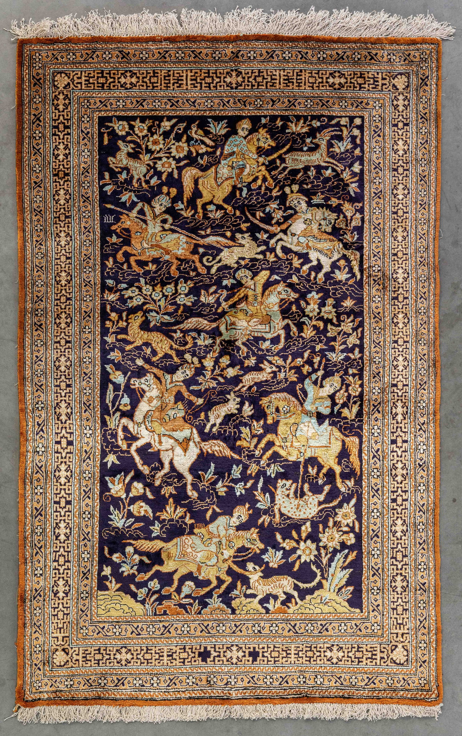 An Oriental hand-made figurative carpet, Ghoum, Iran, silk (82 x 129 cm).: An Oriental hand-made figurative carpet, Ghoum, Iran, silk (82 x 129 cm). (82 x 0 x 129 cm)