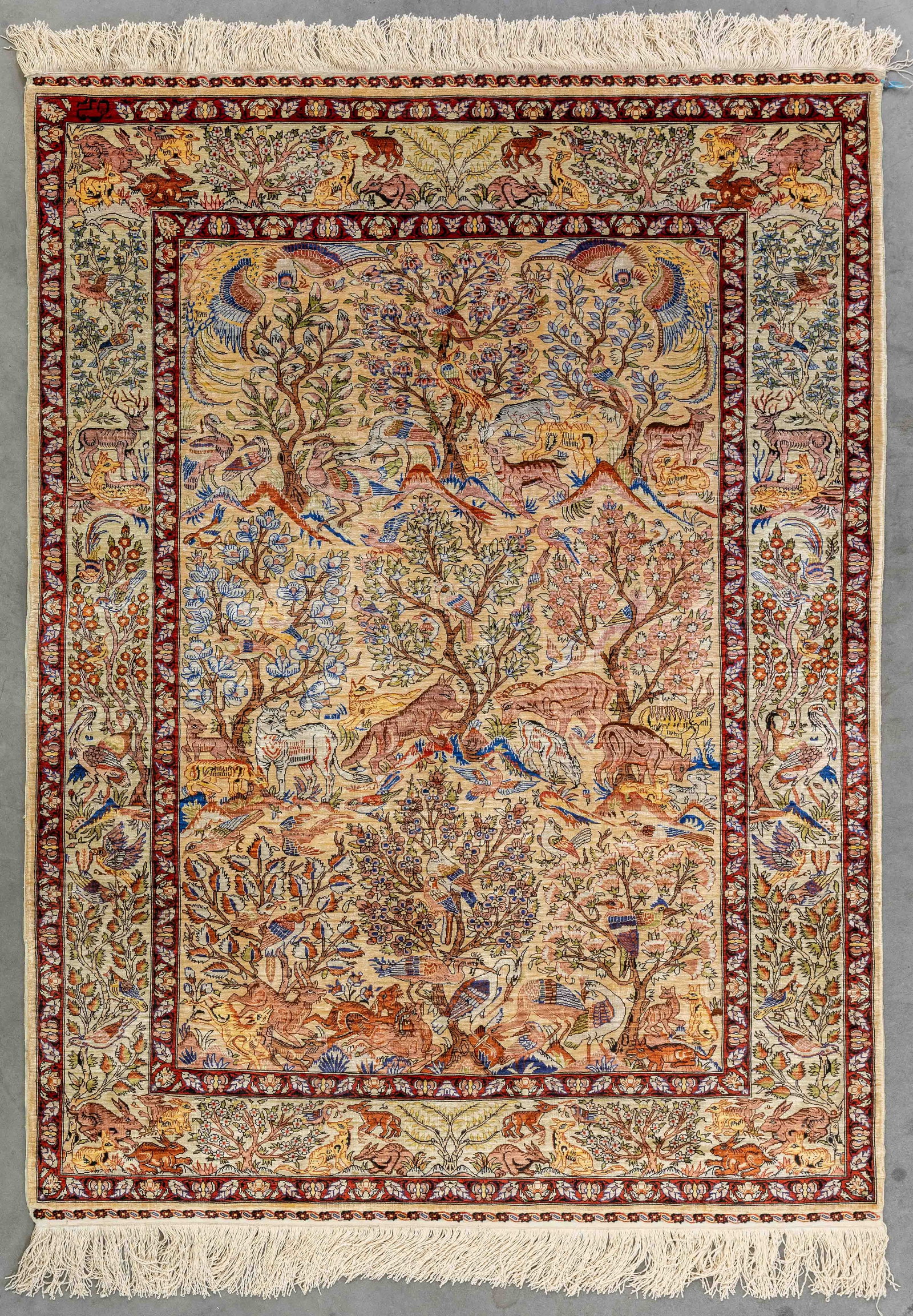 An Oriental hand-made figurative carpet, Hereke, silk, signed (110 x 145 cm). (1 of 9)