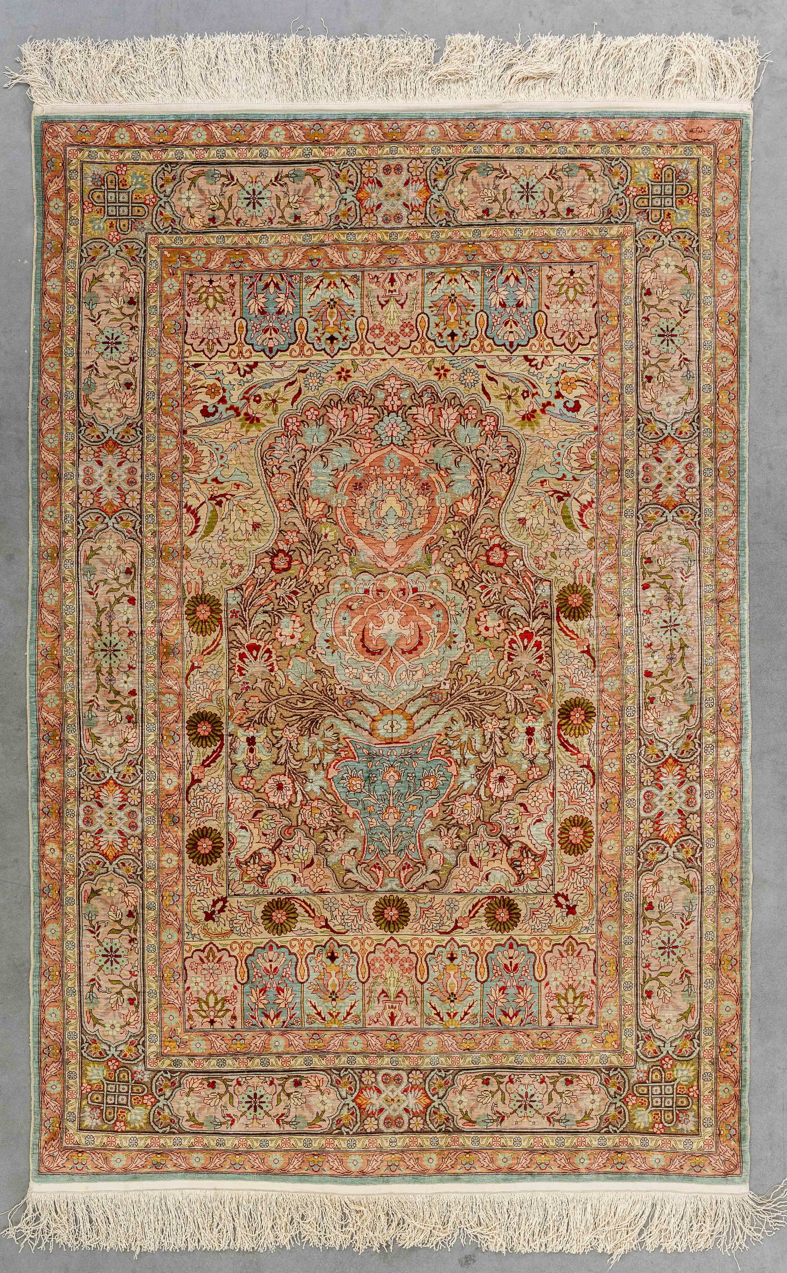 An Oriental hand-made carpet, Hereke, silk and gold thread (105 x 158 cm). (1 of 6)