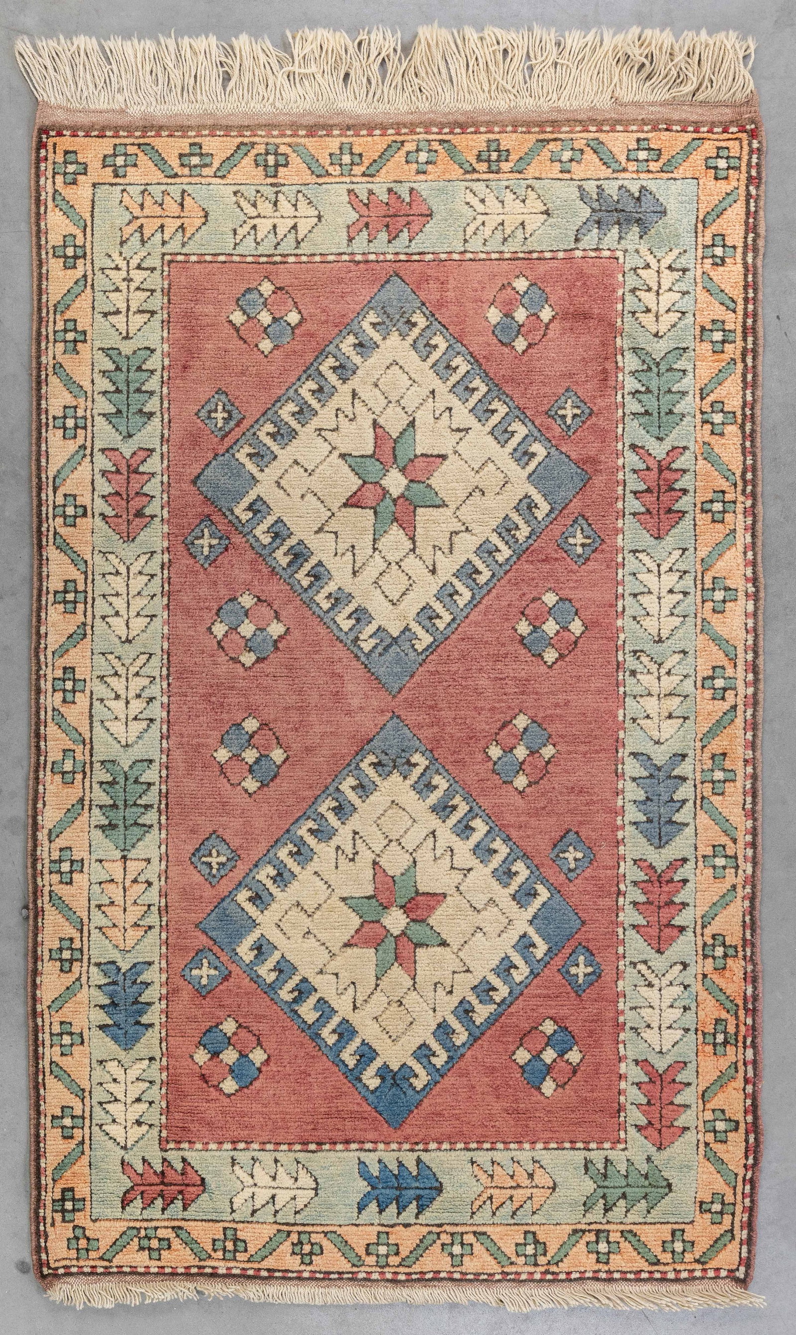 An Oriental hand-made carpet, Kars, Turkiye (151 x 95 cm): An Oriental hand-made carpet, Kars, Turkiye (151 x 95 cm) (95 x 151 x 0 cm)