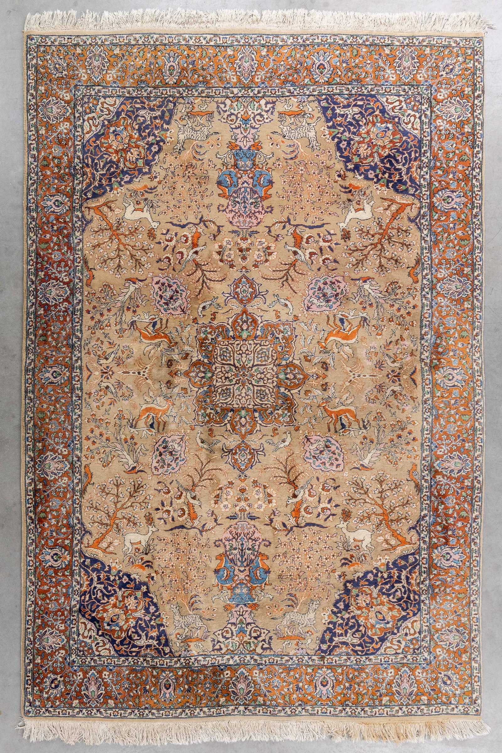 An Oriental hand-made carpet with deer motif, Isfahan, Iran (276 x 185 cm). (1 of 7)