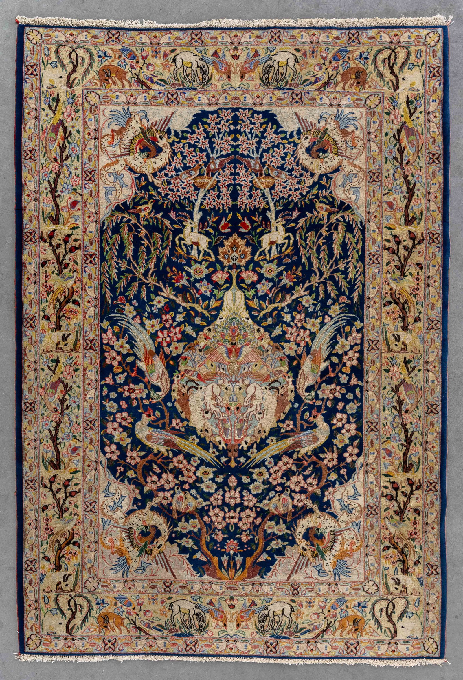 An Oriental hand-made carpet with Tree of Life and pheasant decoration, silk, Persia (154 x 106 cm).: An Oriental hand-made carpet with Tree of Life and pheasant decoration, silk, Persia (154 x 106 cm). (106 x 154 x 0 cm)