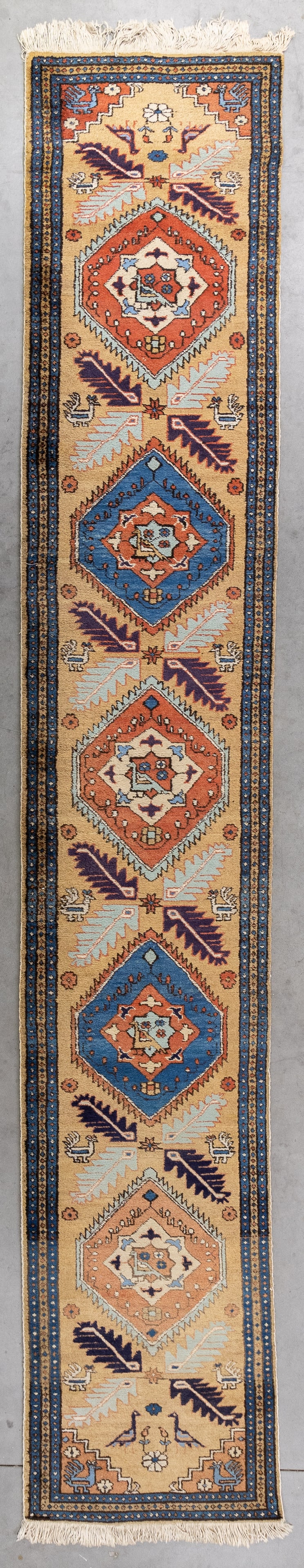 An Oriental hand-made carpet runner, Kazak style, Ardebil, Iran (418 x 72 cm).: An Oriental hand-made carpet runner, Kazak style, Ardebil, Iran (418 x 72 cm). (72 x 418 x 0 cm)