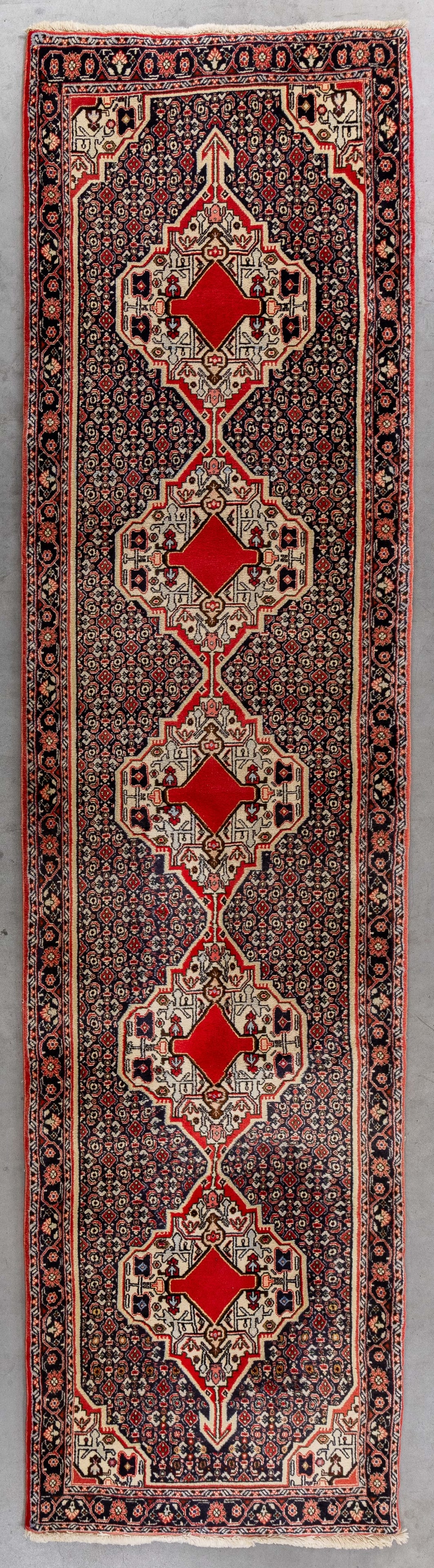 An Oriental hand-made carpet runner, Bidjar, Iran (329 x 85 cm).: An Oriental hand-made carpet runner, Bidjar, Iran (329 x 85 cm). (85 x 329 x 0 cm)