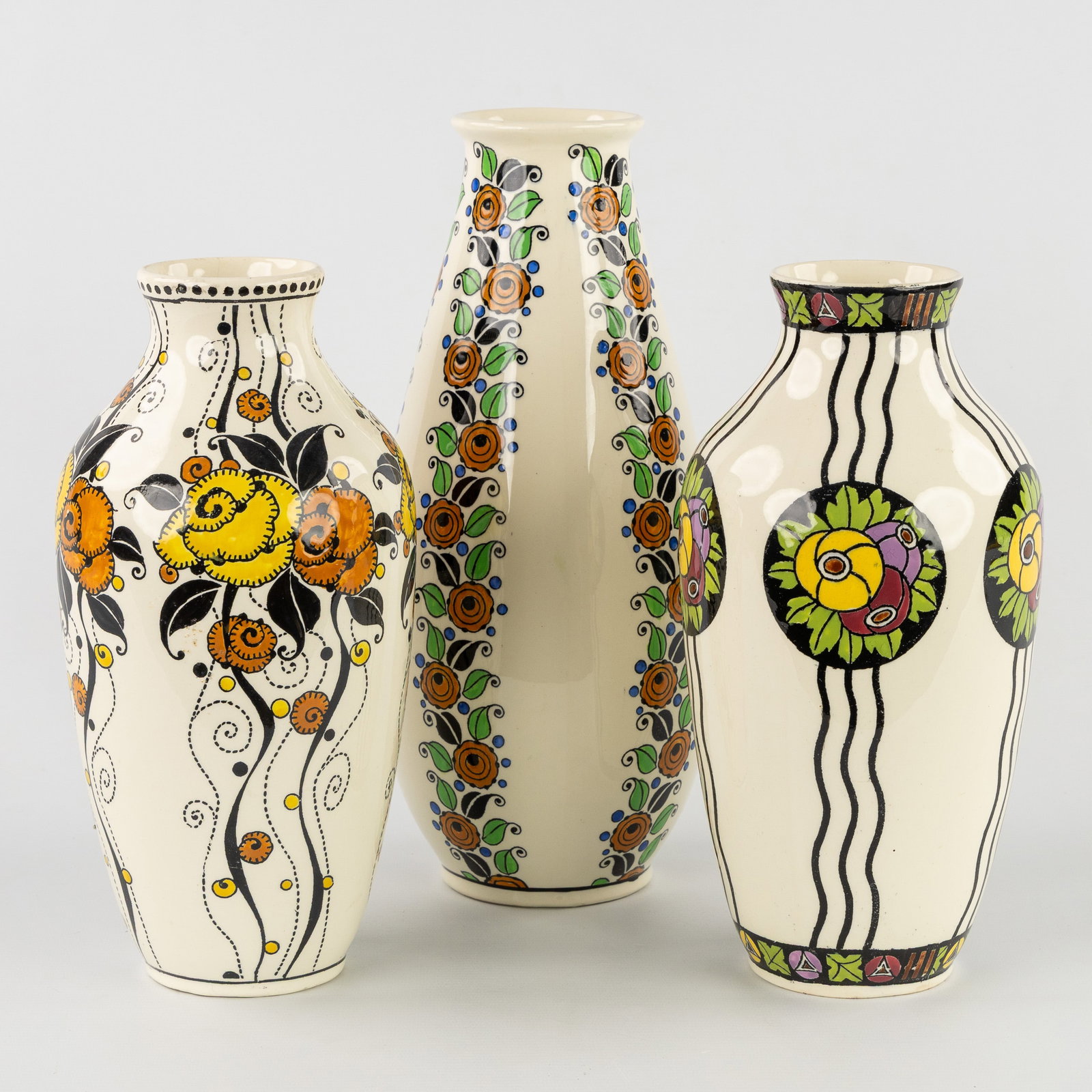Charles Catteau (1880–1966) ‘Three Vases: Multicoloured Decor with Floral Motifs’,: Charles Catteau (1880–1966) ‘Three Vases: Multicoloured Decor with Floral Motifs’, glazed ceramics for Boch Keramis. Three Vases: Multicoloured Decor with Floral Motifs Boch Frè