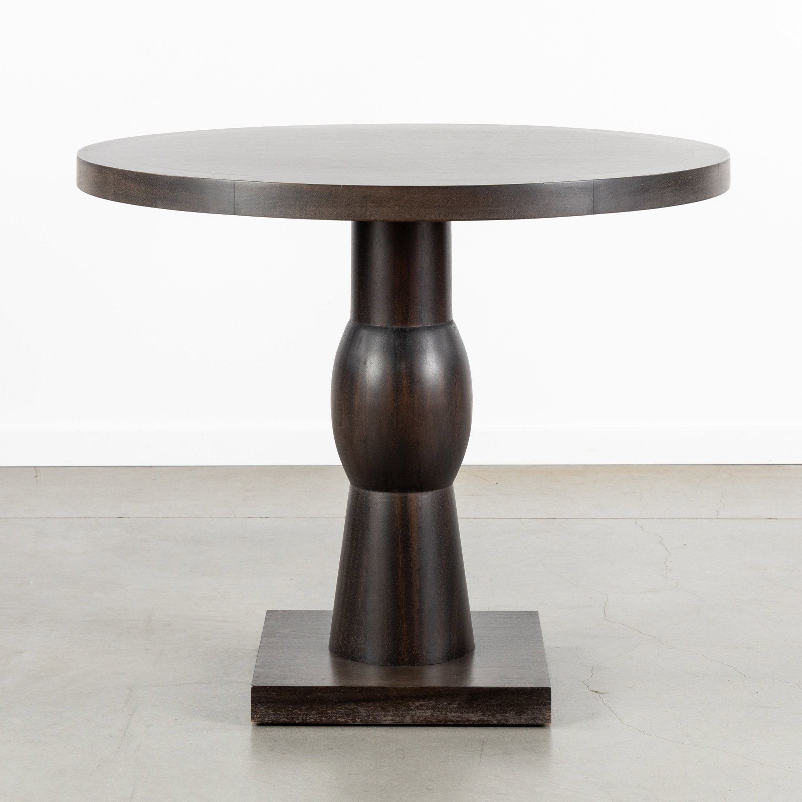 Christian Liaigre (1943-2020) 'Scarabee', a side table or gueridon, France, circa 2000.: Christian Liaigre (1943-2020) 'Scarabee', a side table or gueridon, France, circa 2000. Varnished wood.Model 'Scarabee'.Round side table or gueridon.Designed by Christian Liaigre in 1997.