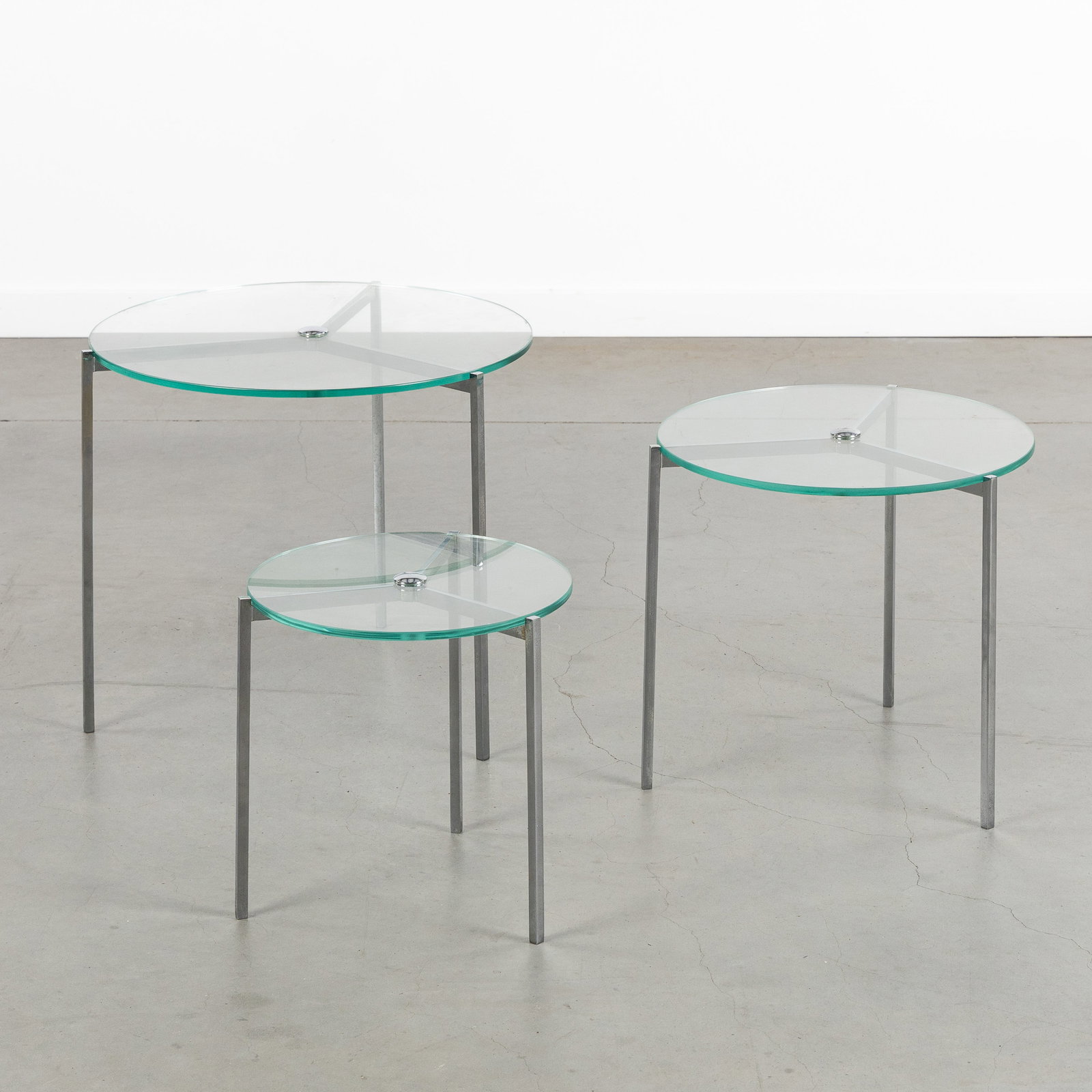 A Set of three round nesting tables, chrome-plated metal and glass. (1 of 6)