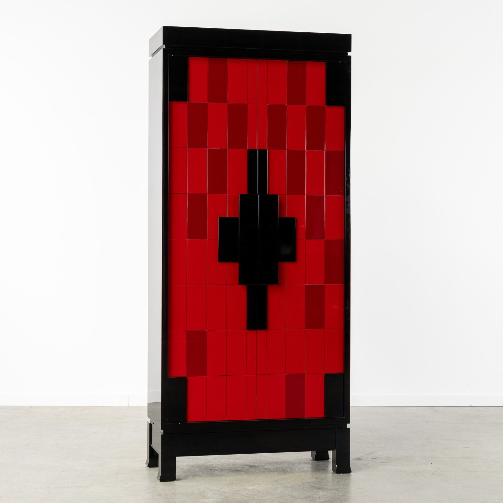 Emiel Veranneman (1924-2004) a special cabinet in red and black lacquer, circa 1980.: Emiel Veranneman (1924-2004) a special cabinet in red and black lacquer, circa 1980. Red and black lacquered wood.Two-door storage cabinet, with geometric decoration of rectangles.Designed by Emiel