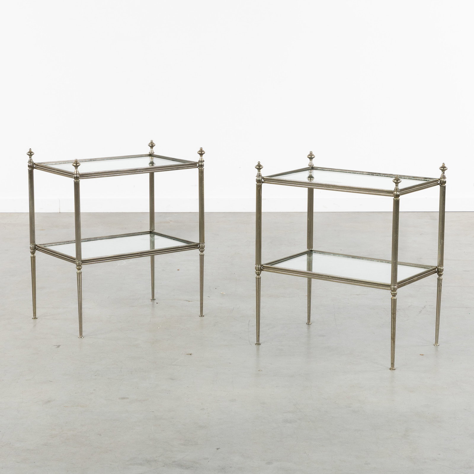 A Pair of side tables, silvered brass and glass, in the style of Maison Jansen, circa 1980. (1 of 6)