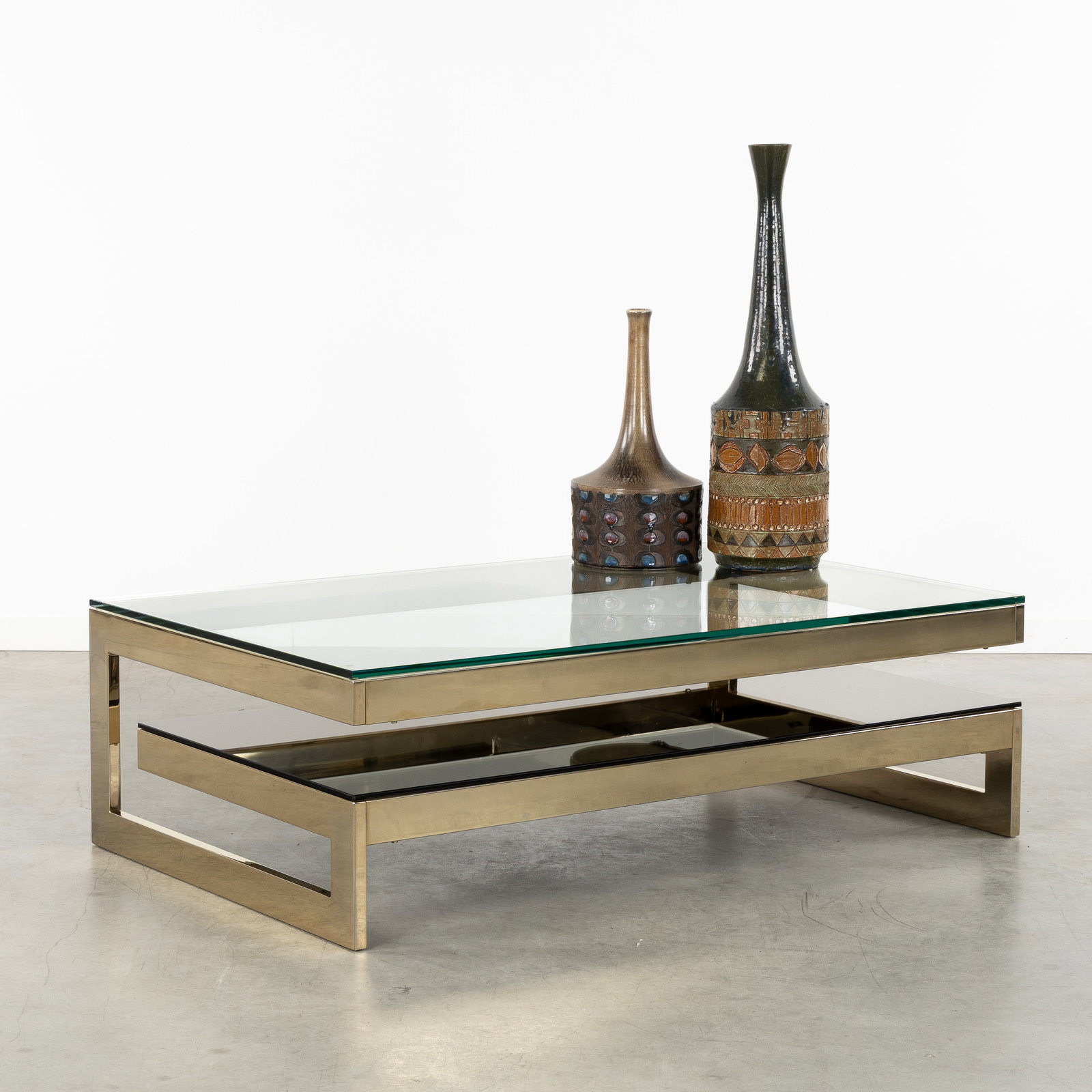 Belgo Chrome, Meutabel, a G-shaped coffee table. Gold-plated metal and glass. Circa 1970. (1 of 6)