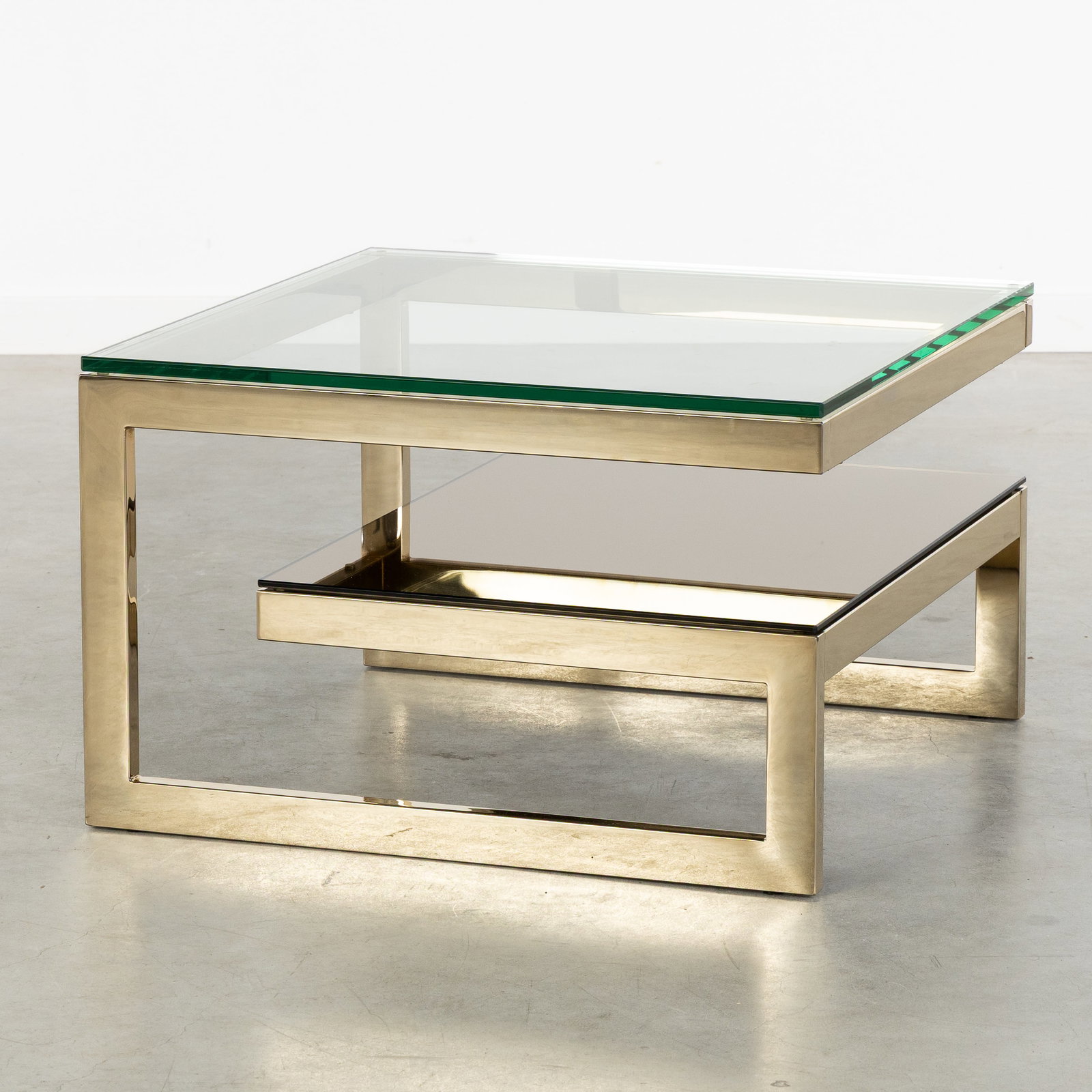 Belgo Chrome, Meutabel, a small square G-shaped side table. Gold-plated metal and glass. Circa 1970.: Belgo Chrome, Meutabel, a small square G-shaped side table. Gold-plated metal and glass. Circa 1970. Gold-plated metal and tinted glass.Design by Ignace Opsomer, for Meutabel.Manufactured by Meutabe