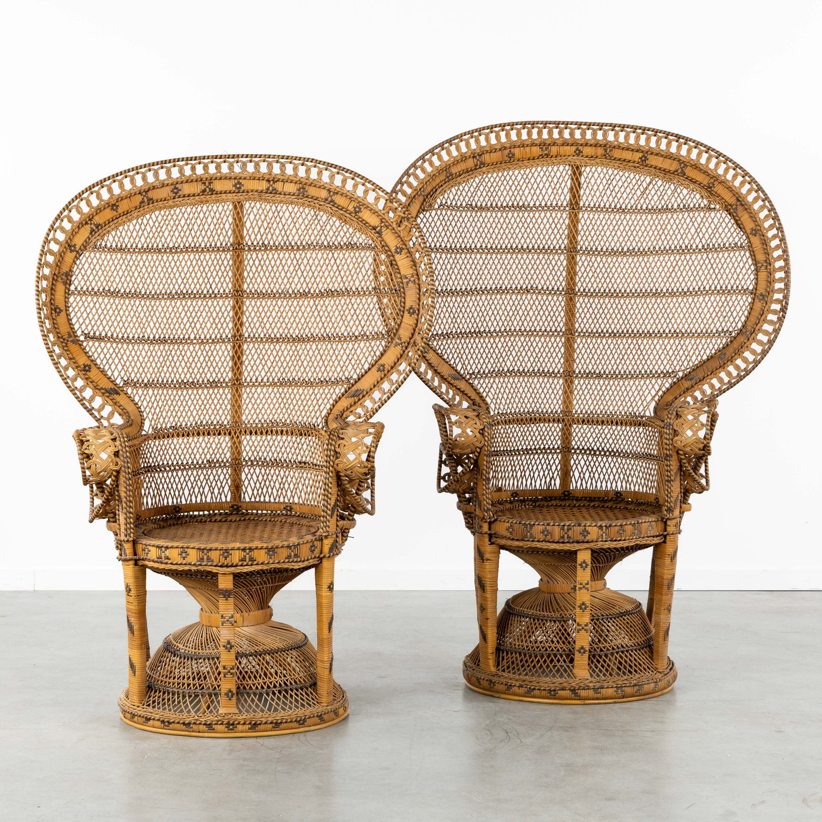 A Pair of rattan 'Emmanuelle' chairs or Peacock chairs, male and female, circa 1970-1980. (1 of 10)
