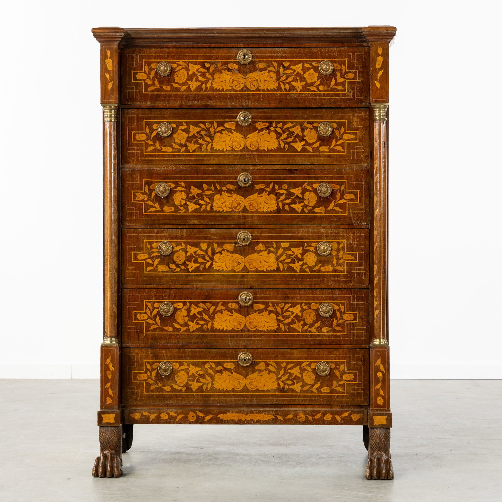 An Antique Regency chest of drawers, rich floral marquetry and lion's paws, England, 19th C.: An Antique Regency chest of drawers, rich floral marquetry and lion's paws, England, 19th century. Floral marquetry, with flower vases and birds.Chest of drawers with six drawers, flanked by columns.