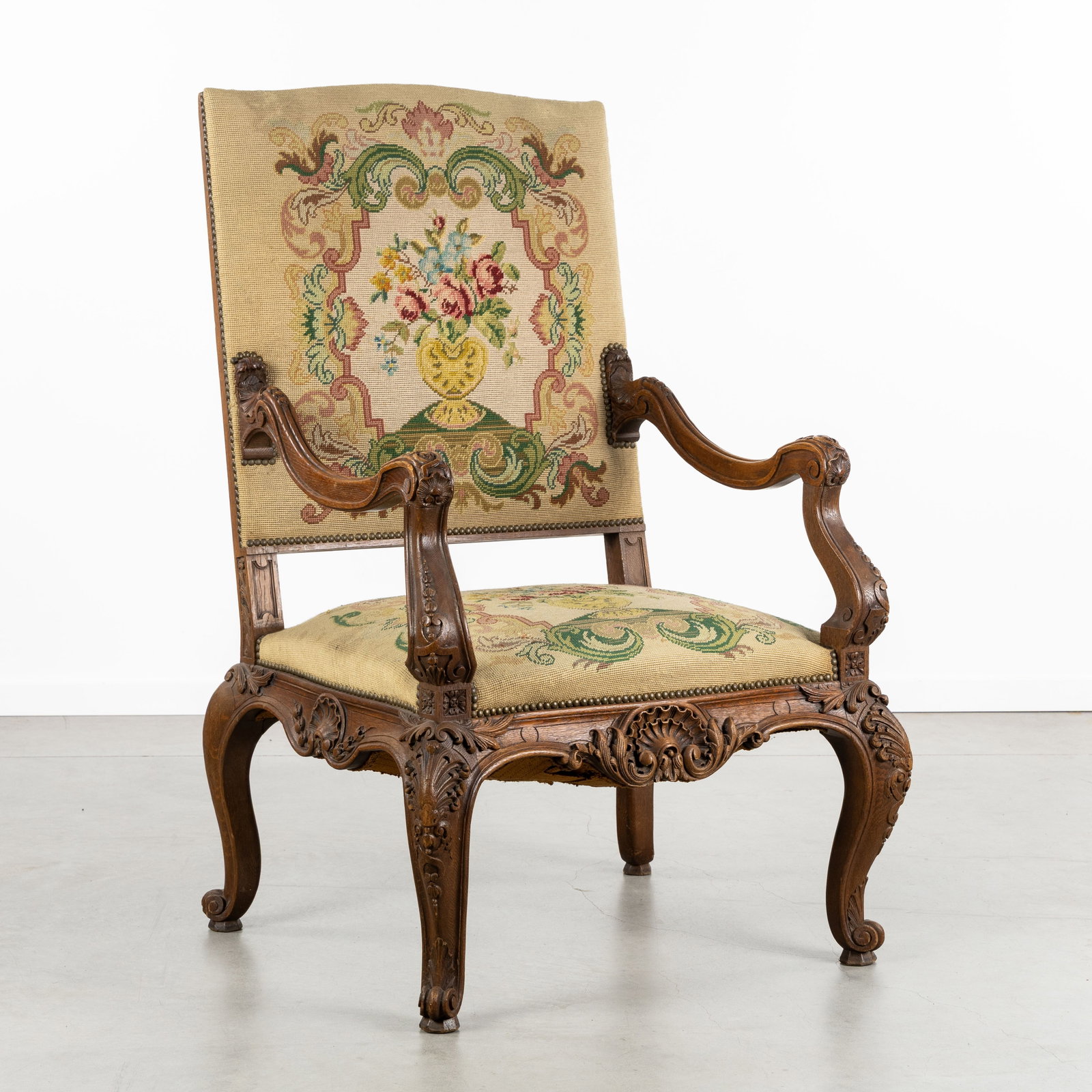 A Large throne chair, finished with embroidery, Renaissance and Louis XV style.: A Large throne chair, finished with embroidery, Renaissance and Louis XV style. Sculptured wood.Throne seat, throne chair, or armchair.Decorated with acanthus leaves and rocaille, Louis XV style.