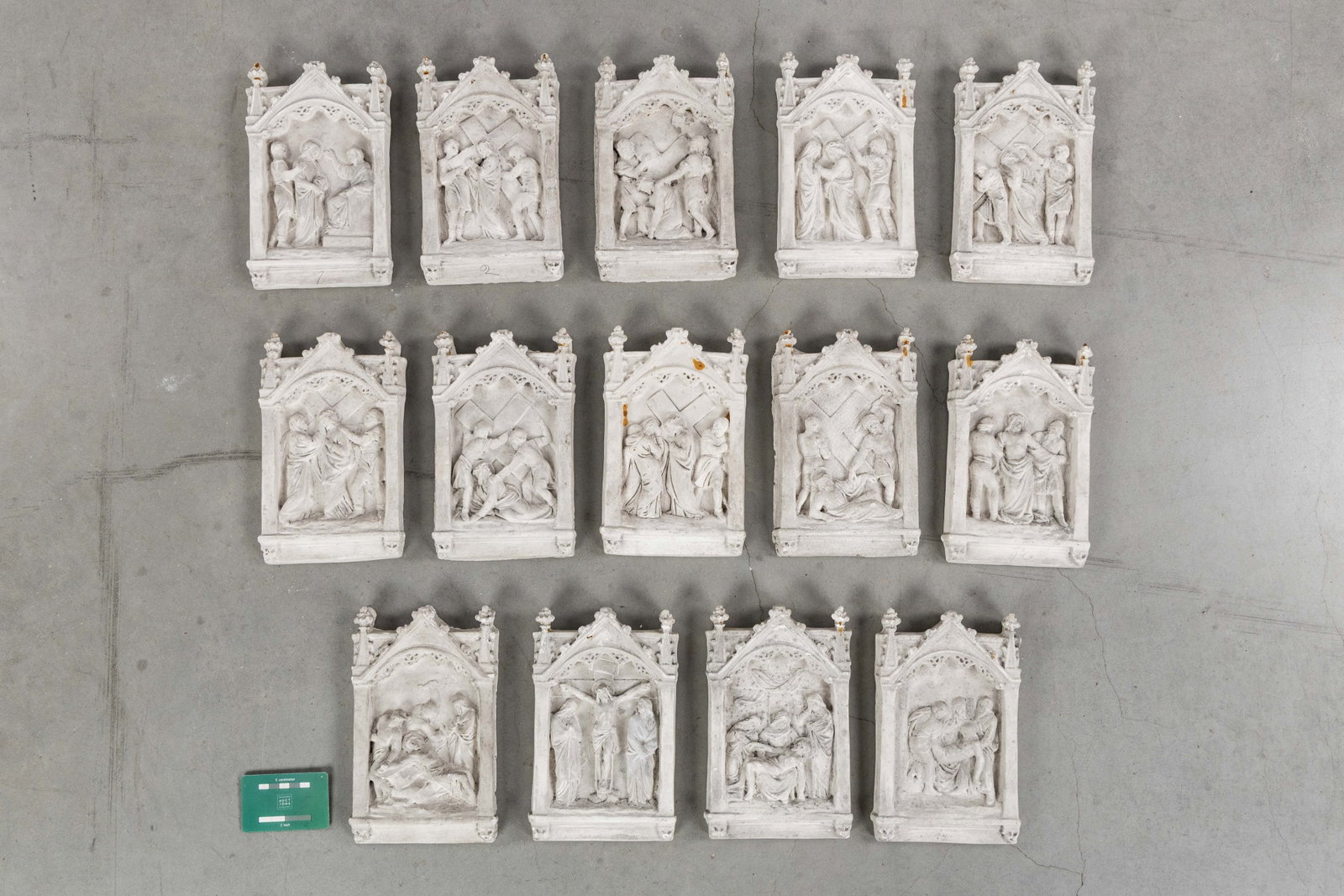 A 14-piece Stations of the Cross with plaster bas-relief sculptures, Gothic Revival.: A 14-piece Stations of the Cross with plaster bas-relief sculptures, Gothic Revival. Plaster Stations of the Cross. Plaques or bas-reliefs depicting the 14 Stations of the Cross, set within Gothic nic