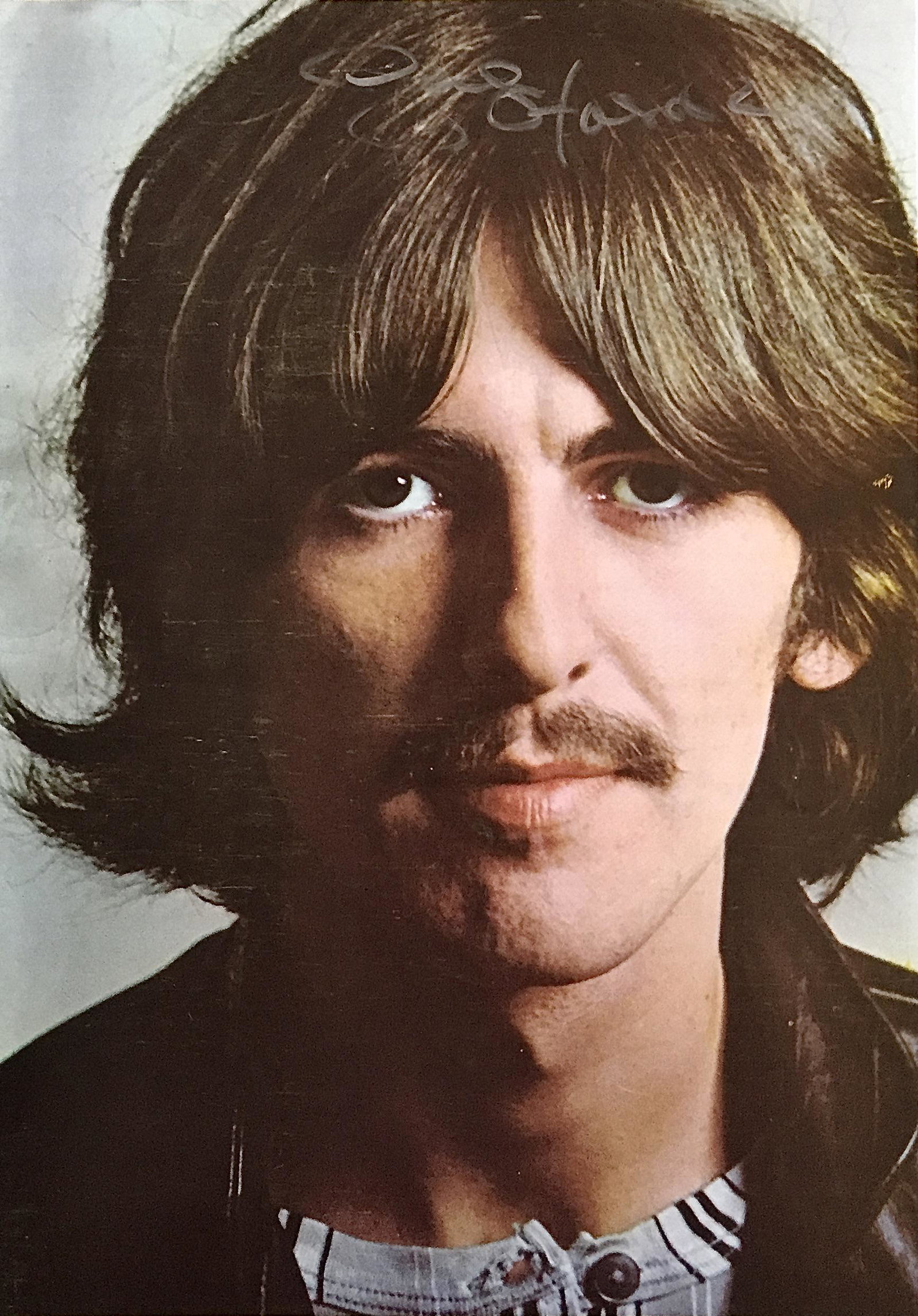 George Harrison Signed Photo: Beatles member George Harrison autographed photo (8x11). COA provided by Auctions Xpress.