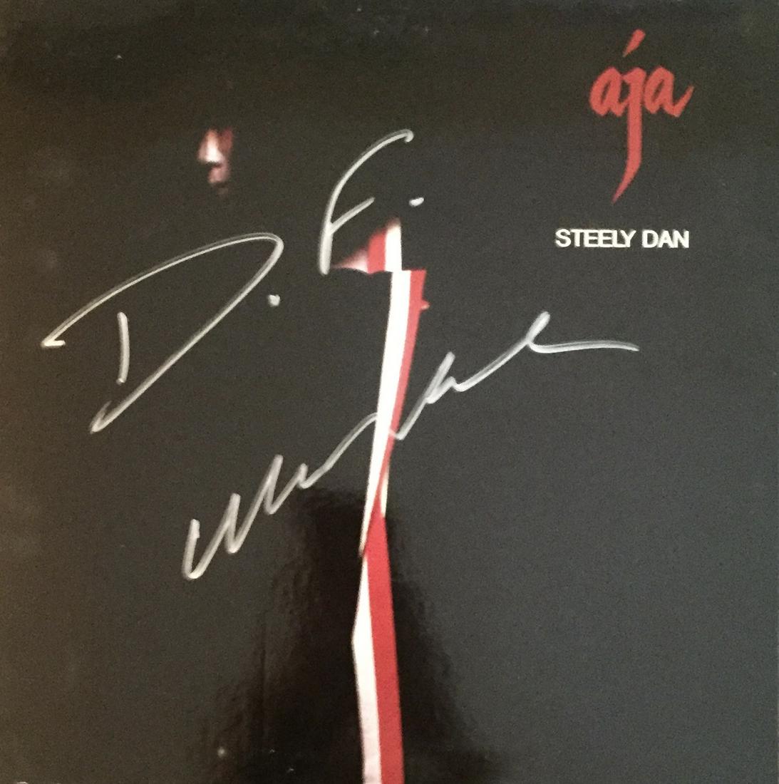 Steely Dan Autographed Album: Signed vinyl record, COA provided by Auctions Xpress.