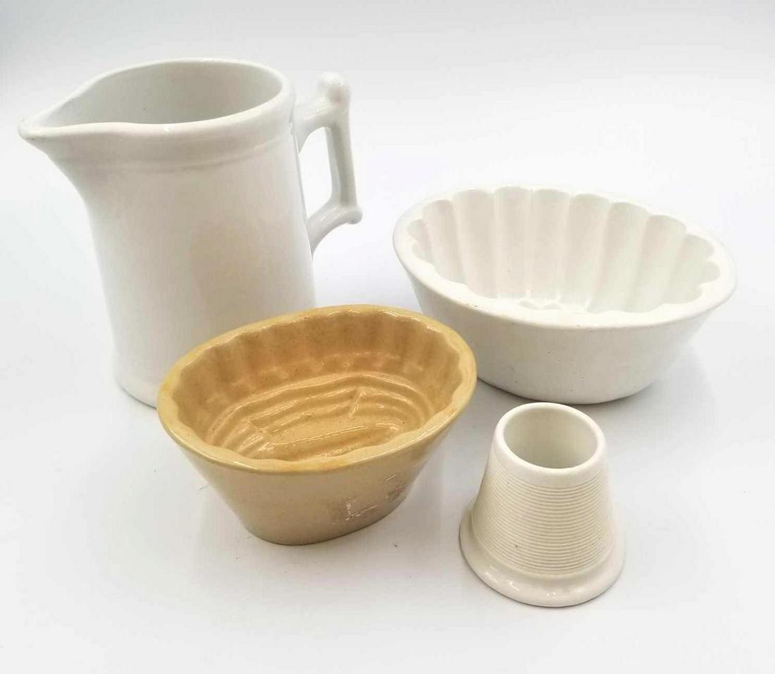 Primitive Stoneware Collection: A series of stoneware pieces. We have yellow stoneware corn mold and a white iron stoneware mold. There is a white ironstone match stick holder and an 1890-1930s West End Pottery Company white milk gl