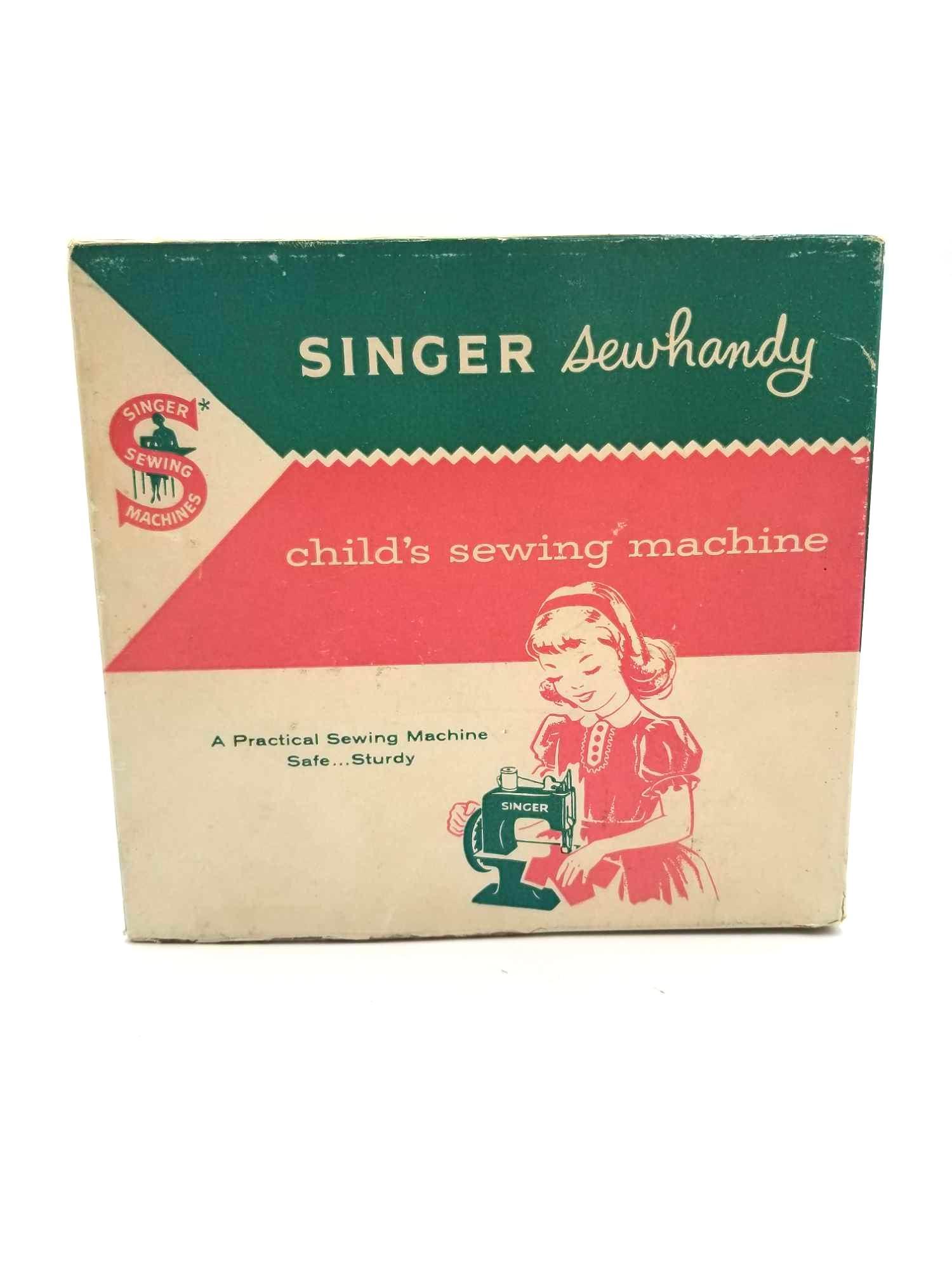 1950's Singer Sewhandy Child's Sewing Machine: Like new 1950's Singer Sewhandy Child Sewing Machine. Shaded in a rouge pink it has the original Singer gold stamped seal, painted lettering, and mechanisms all in perfect condition. Includes the orig