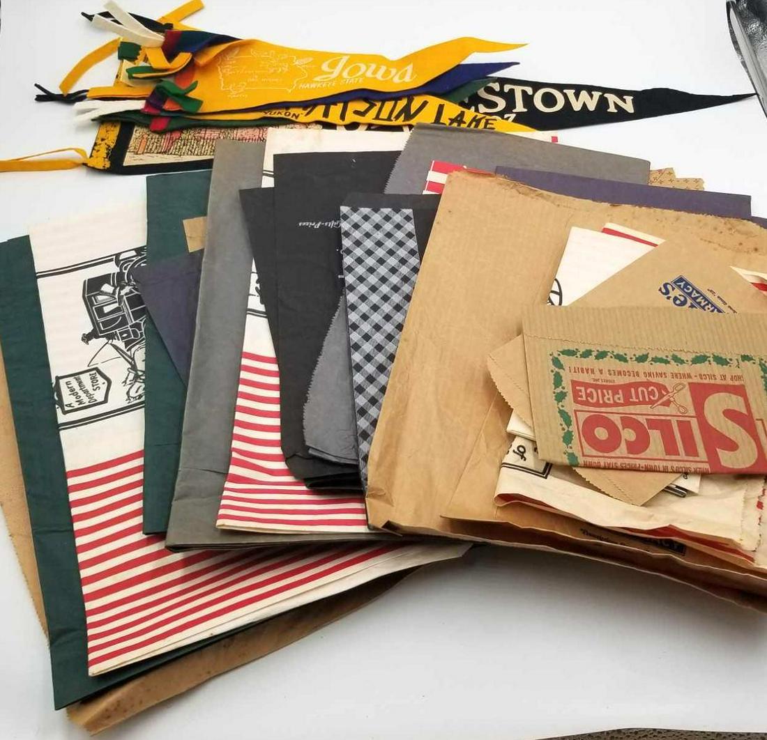 Vintage Shopping Bags and Pennants: This lot contains 6 pennants (North Dakota, Minnesota, Iowa, Watson Lake, Alaska, and Jamestown, VA 1607), also various old shopping bags including RIddle's Pharmacy, Casey's Inc, Ben Franklin Store, 