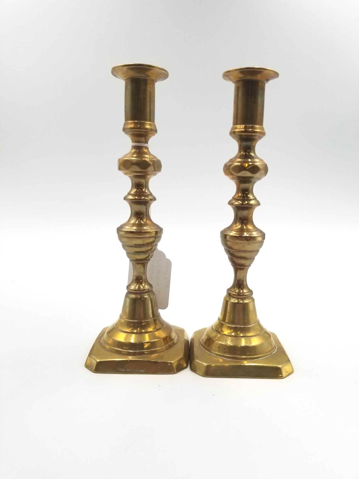 Vintage Brass English Push Up Candle Sticks: Set of very good brass push up candlestick holders. Some fading on the metal as expected with use and material on an item of this age. Width: 3 inches Length: 3 inches Height: 9 inches